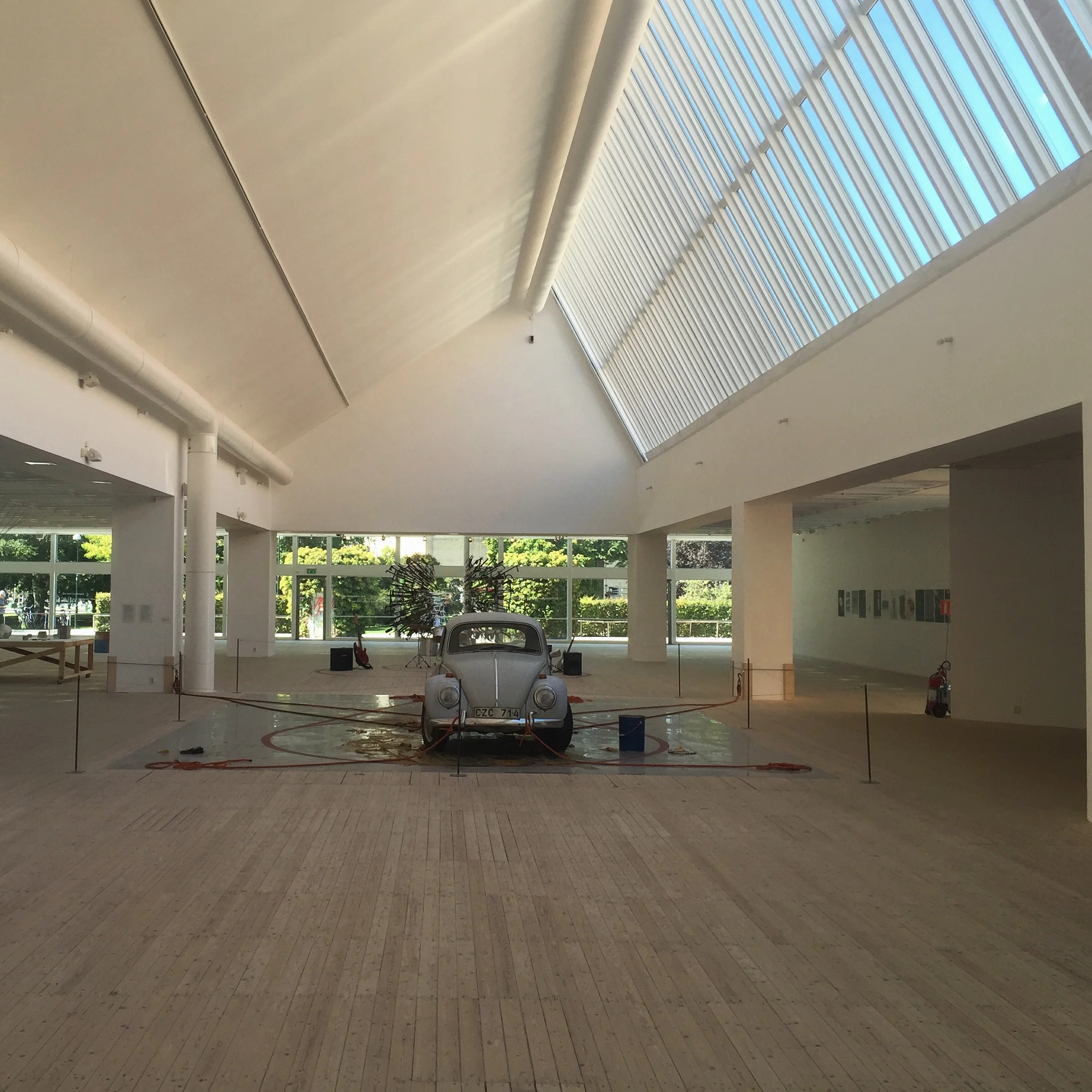A view of the exhibition space overlooking the urban plaza in front of the building.