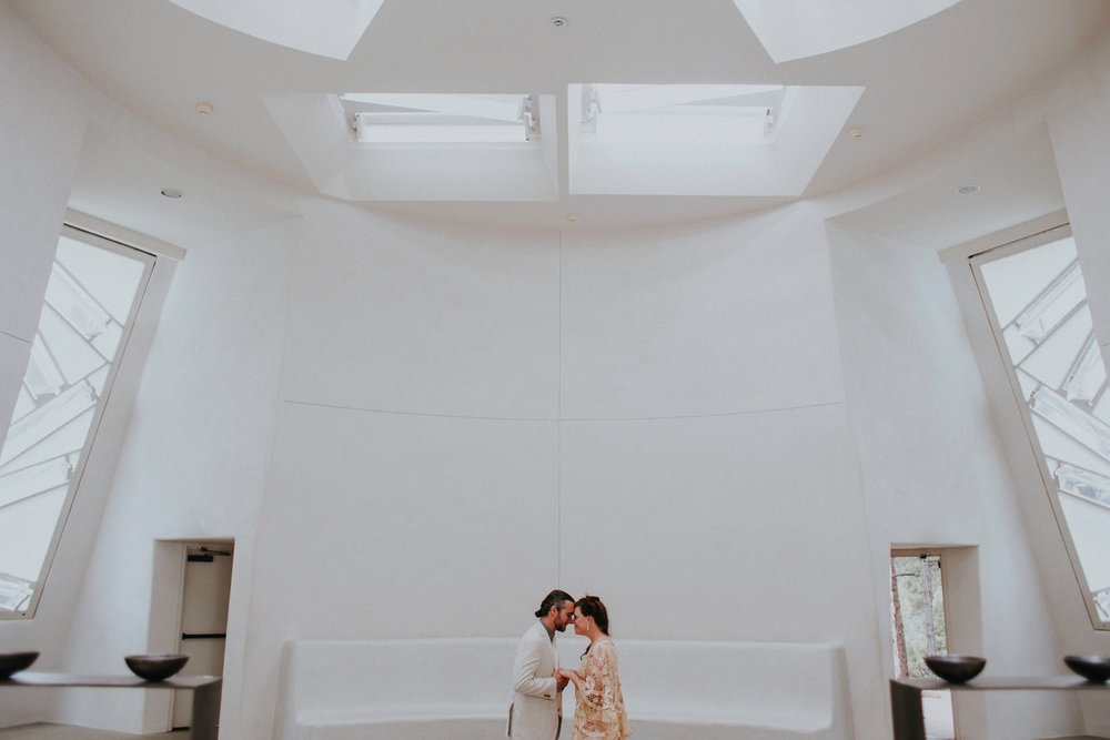  The dress theme for the whole wedding celebration was rainbows - their guests dressed in one color head to toe as part of the theme. The wedding reception at the ranch was near the orchard by the acequia, and was lit by candles and solar lights prim