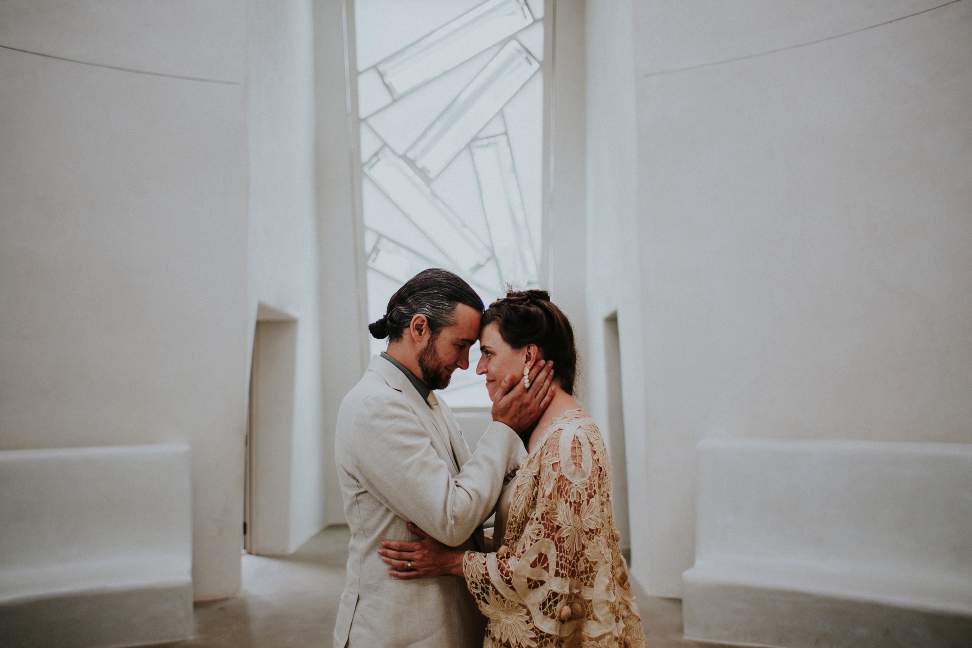  The dress theme for the whole wedding celebration was rainbows - their guests dressed in one color head to toe as part of the theme. The wedding reception at the ranch was near the orchard by the acequia, and was lit by candles and solar lights prim