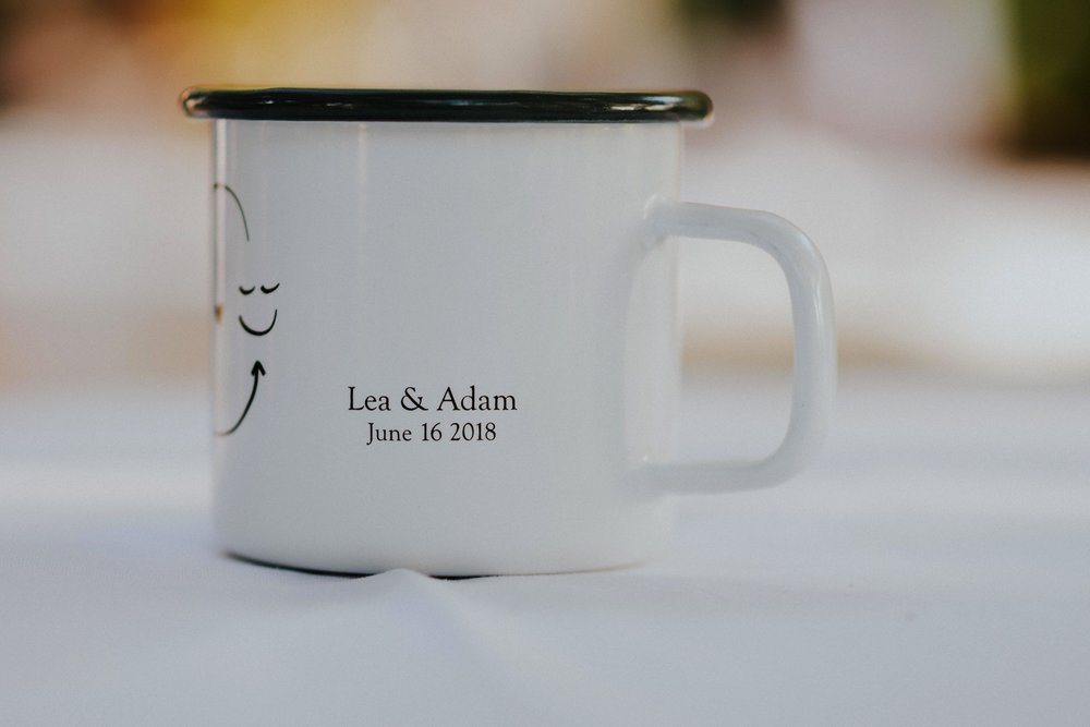  They arrived by rainbow procession from the river to their gorgeous wedding reception. They made cups for everyone with an image from a note one of them left for the other early in their relationship that has become a note that they leave often for 