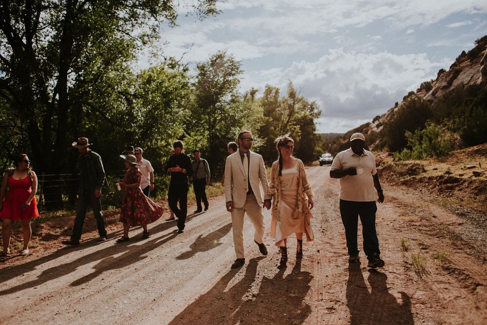  They arrived by rainbow procession from the river to their gorgeous wedding reception. They made cups for everyone with an image from a note one of them left for the other early in their relationship that has become a note that they leave often for 