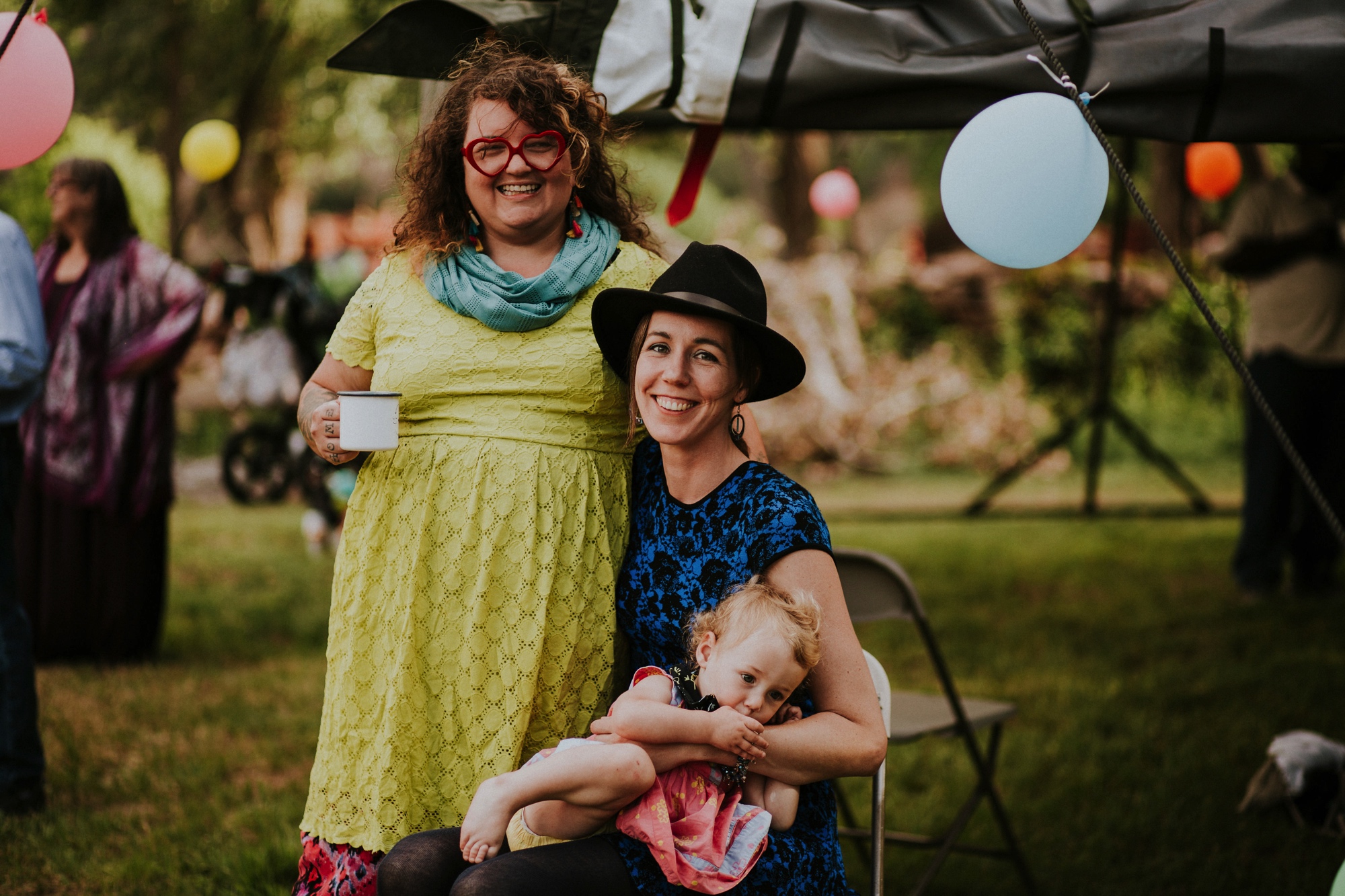  The dress theme for the whole wedding celebration was rainbows - their guests dressed in one color head to toe as part of the theme. The wedding reception at the ranch was near the orchard by the acequia, and was lit by candles and solar lights prim