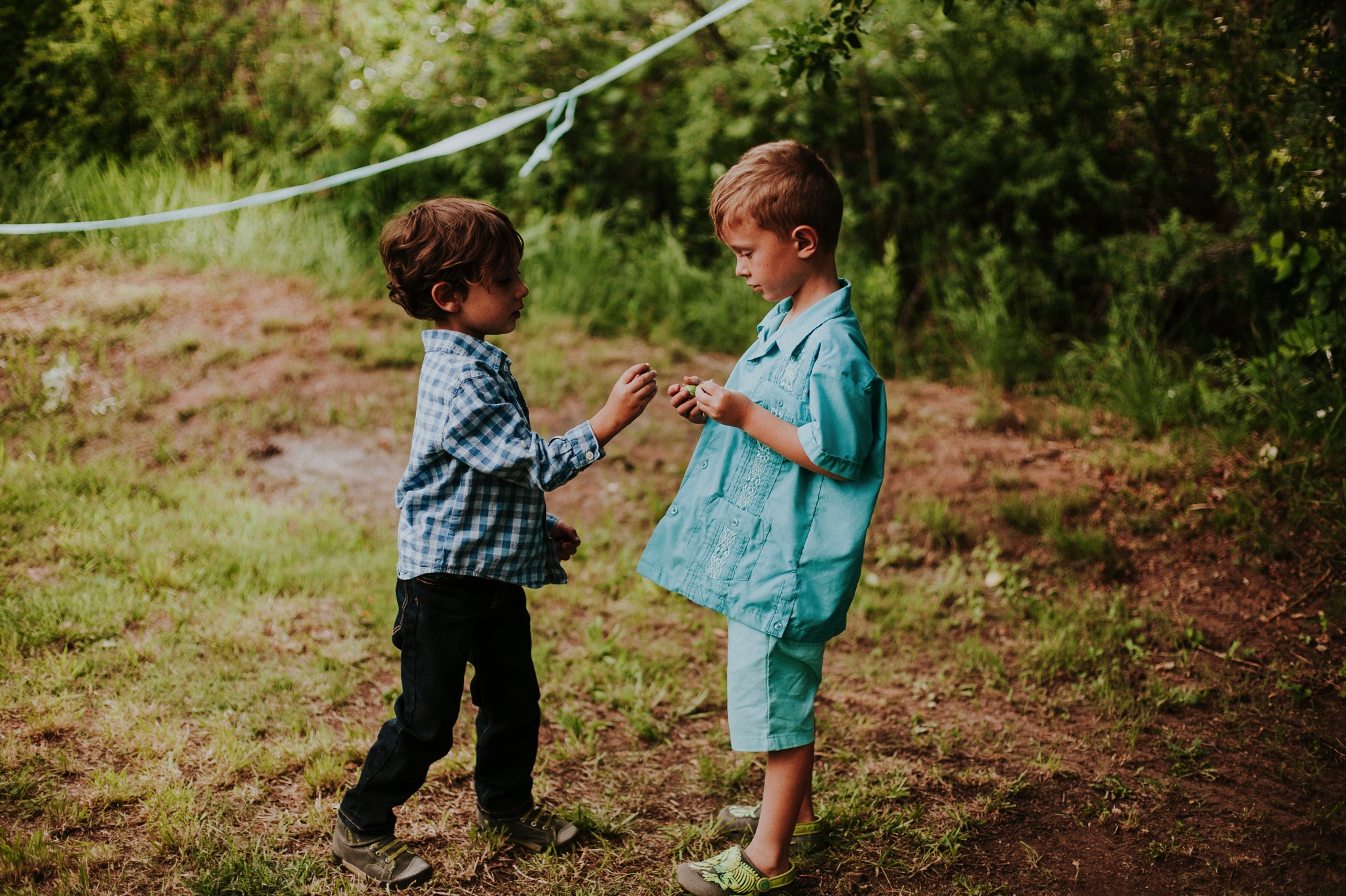  The dress theme for the whole wedding celebration was rainbows - their guests dressed in one color head to toe as part of the theme. The wedding reception at the ranch was near the orchard by the acequia, and was lit by candles and solar lights prim