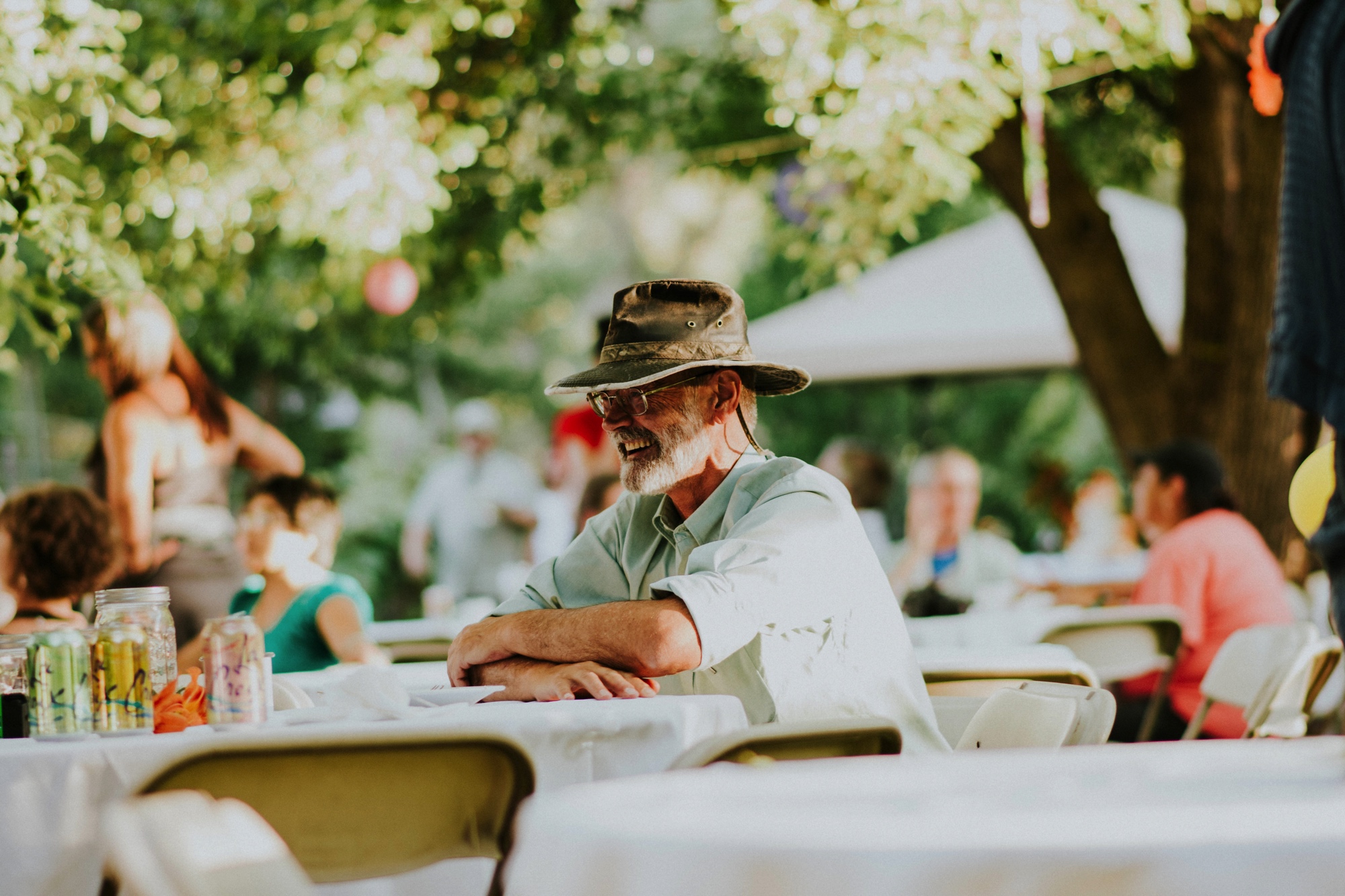  The dress theme for the whole wedding celebration was rainbows - their guests dressed in one color head to toe as part of the theme. The wedding reception at the ranch was near the orchard by the acequia, and was lit by candles and solar lights prim