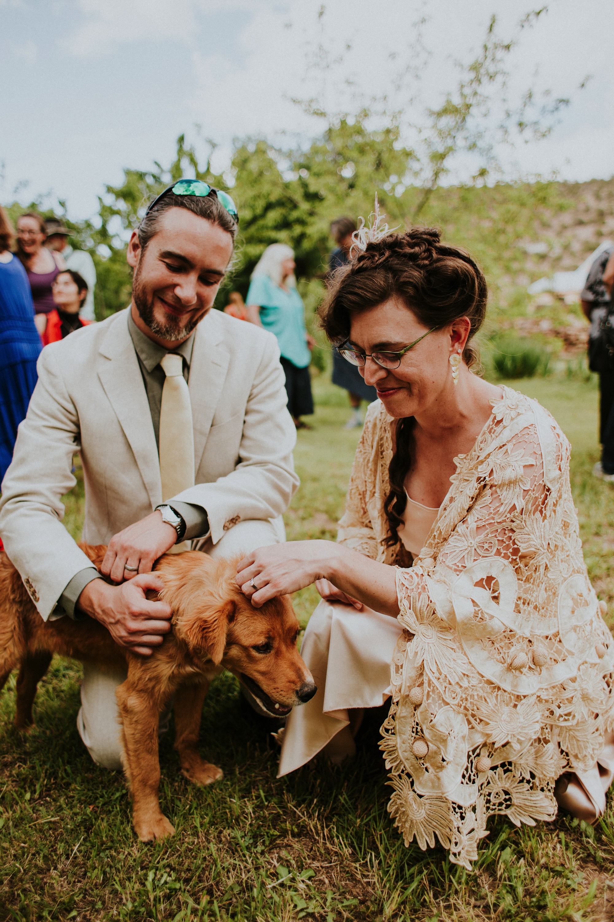  The dress theme for the whole wedding celebration was rainbows - their guests dressed in one color head to toe as part of the theme. The wedding reception at the ranch was near the orchard by the acequia, and was lit by candles and solar lights prim