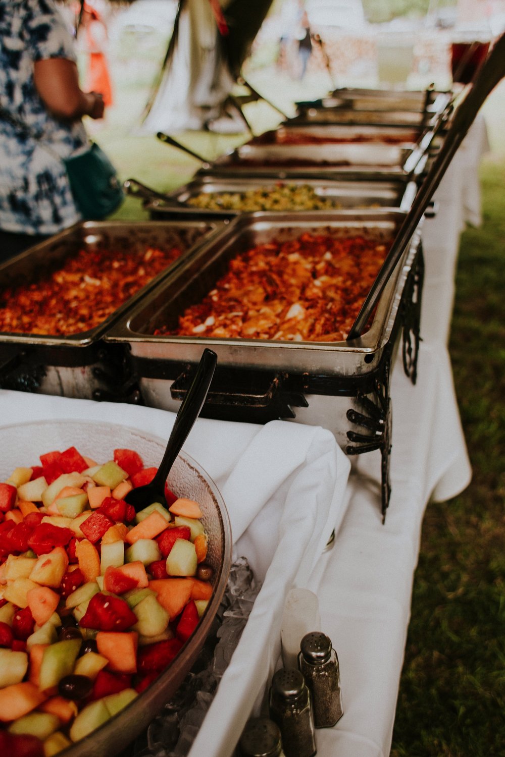  The dress theme for the whole wedding celebration was rainbows - their guests dressed in one color head to toe as part of the theme. The wedding reception at the ranch was near the orchard by the acequia, and was lit by candles and solar lights prim