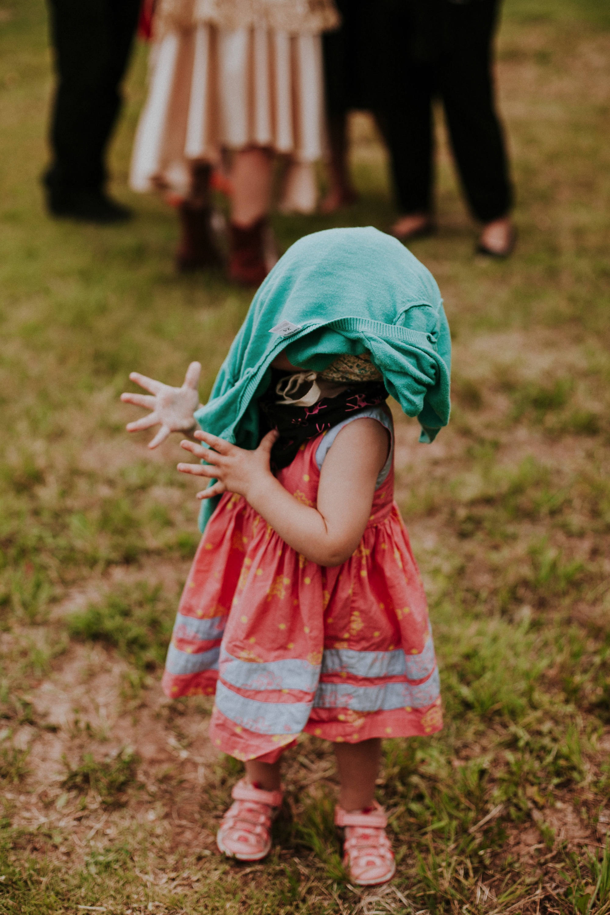  The dress theme for the whole wedding celebration was rainbows - their guests dressed in one color head to toe as part of the theme. The wedding reception at the ranch was near the orchard by the acequia, and was lit by candles and solar lights prim