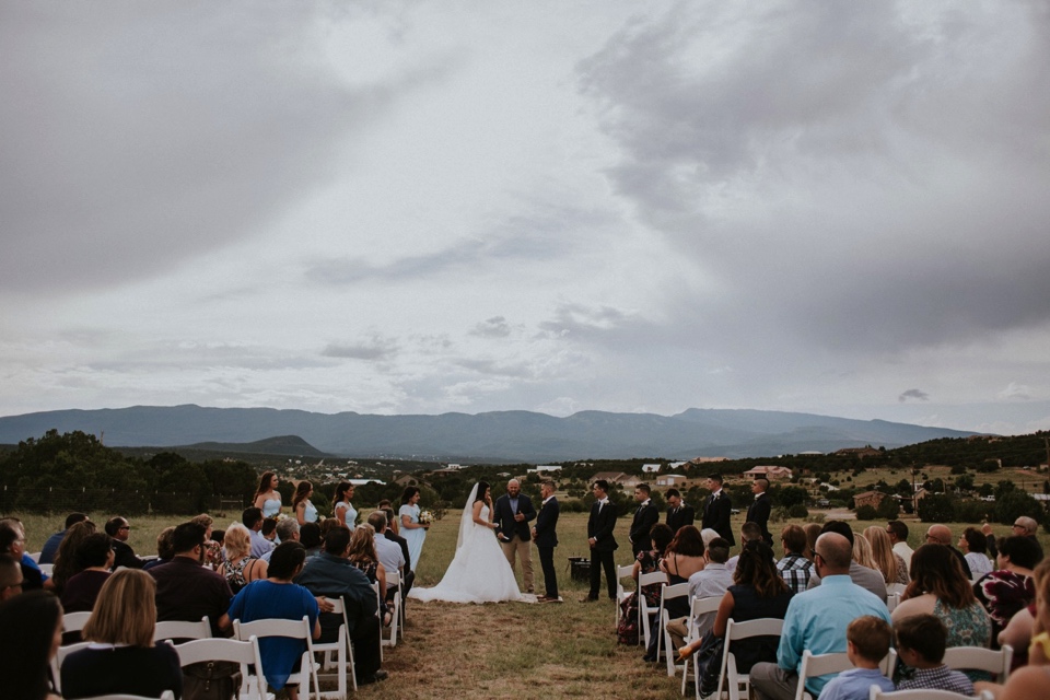  Stephanie and Greg tied the knot on August 18th, 2018 in the backyard of her sister’s house in Sandia Park just outside of Albuquerque, New Mexico. They chose to have their wedding at Stephanie’s sister’s house in the mountains because they love the