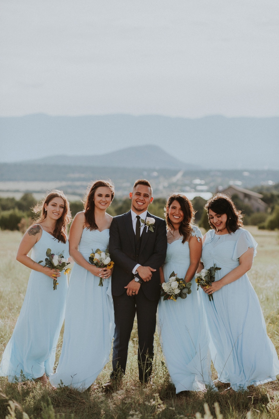 Stephanie and Greg tied the knot on August 18th, 2018 in the backyard of her sister’s house in Sandia Park just outside of Albuquerque, New Mexico. They chose to have their wedding at Stephanie’s sister’s house in the mountains because they love the natural feel of being outside to appreciate Gods creation. The wedding decor color palette was inspired by blues and nude tones.
