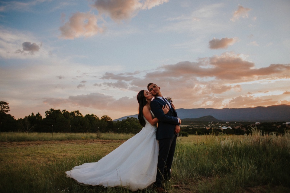  Stephanie and Greg tied the knot on August 18th, 2018 in the backyard of her sister’s house in Sandia Park just outside of Albuquerque, New Mexico. They chose to have their wedding at Stephanie’s sister’s house in the mountains because they love the