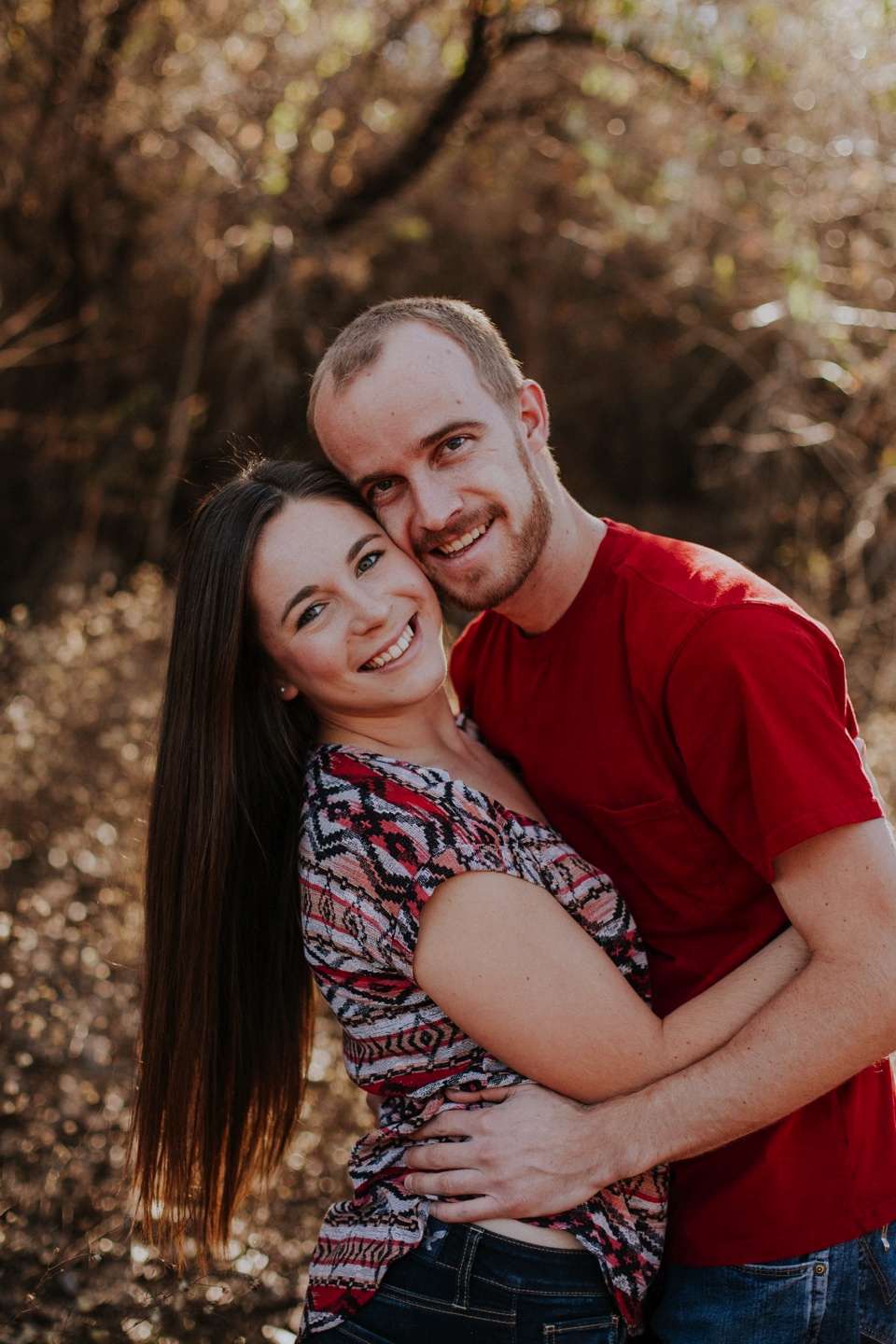  We met up again in Albuquerque, New Mexico and ventured to the Albuquerque bosque to take some fall inspired engagement photos. I loved the warm color palette they chose for their attire for this part of the session! We also had to take some cute en