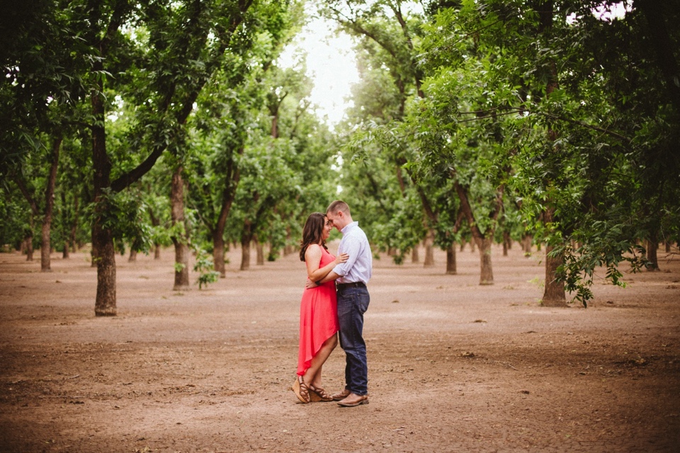  We kicked off their beautiful engagement session at the pecan orchards in Las Cruces, New Mexico. I loved Kristina’s beautiful pink dress and Mitch’s rustic yet classy outfit. Talk about engagement photo inspiration! 