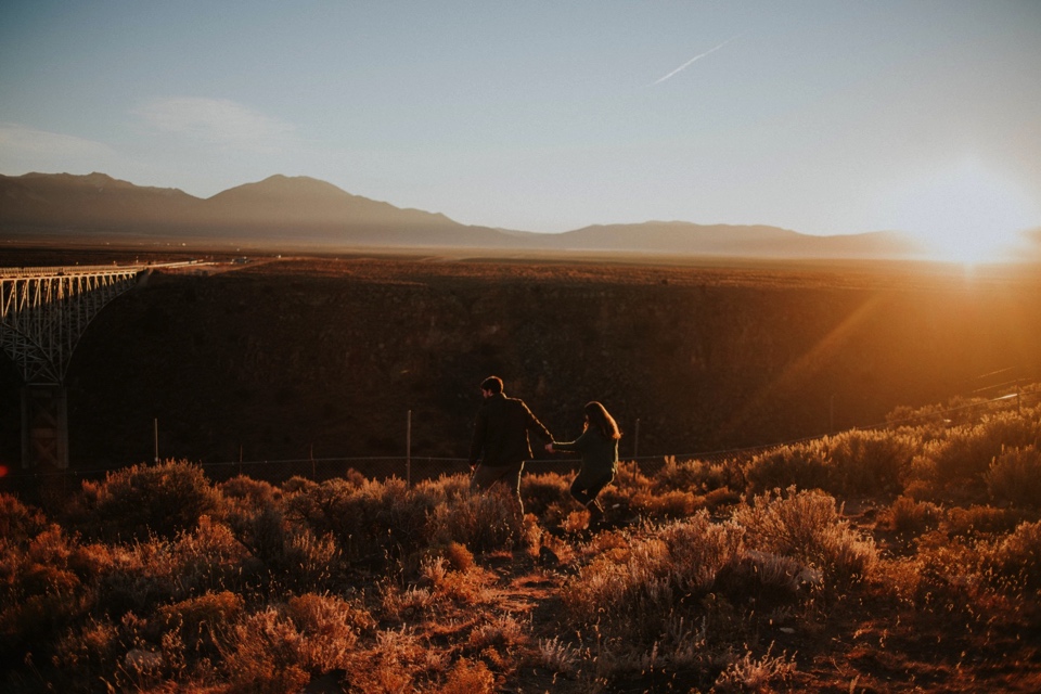 Natalie and Boots traveled all the way from the sunshine state for their beautiful Sunrise Engagement Photos at the Rio Grande Gorge Bridge in Taos, New Mexico. It was a chilly morning in Taos and we were all pretty frozen! It was 6 degree weather w