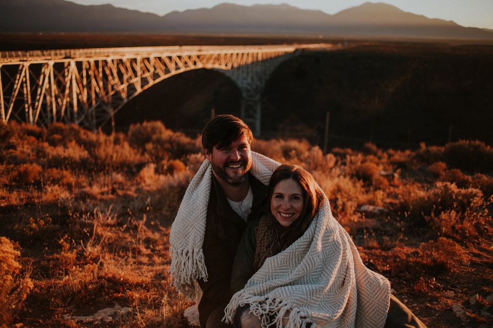  Natalie and Boots traveled all the way from the sunshine state for their beautiful Sunrise Engagement Photos at the Rio Grande Gorge Bridge in Taos, New Mexico. It was a chilly morning in Taos and we were all pretty frozen! It was 6 degree weather w