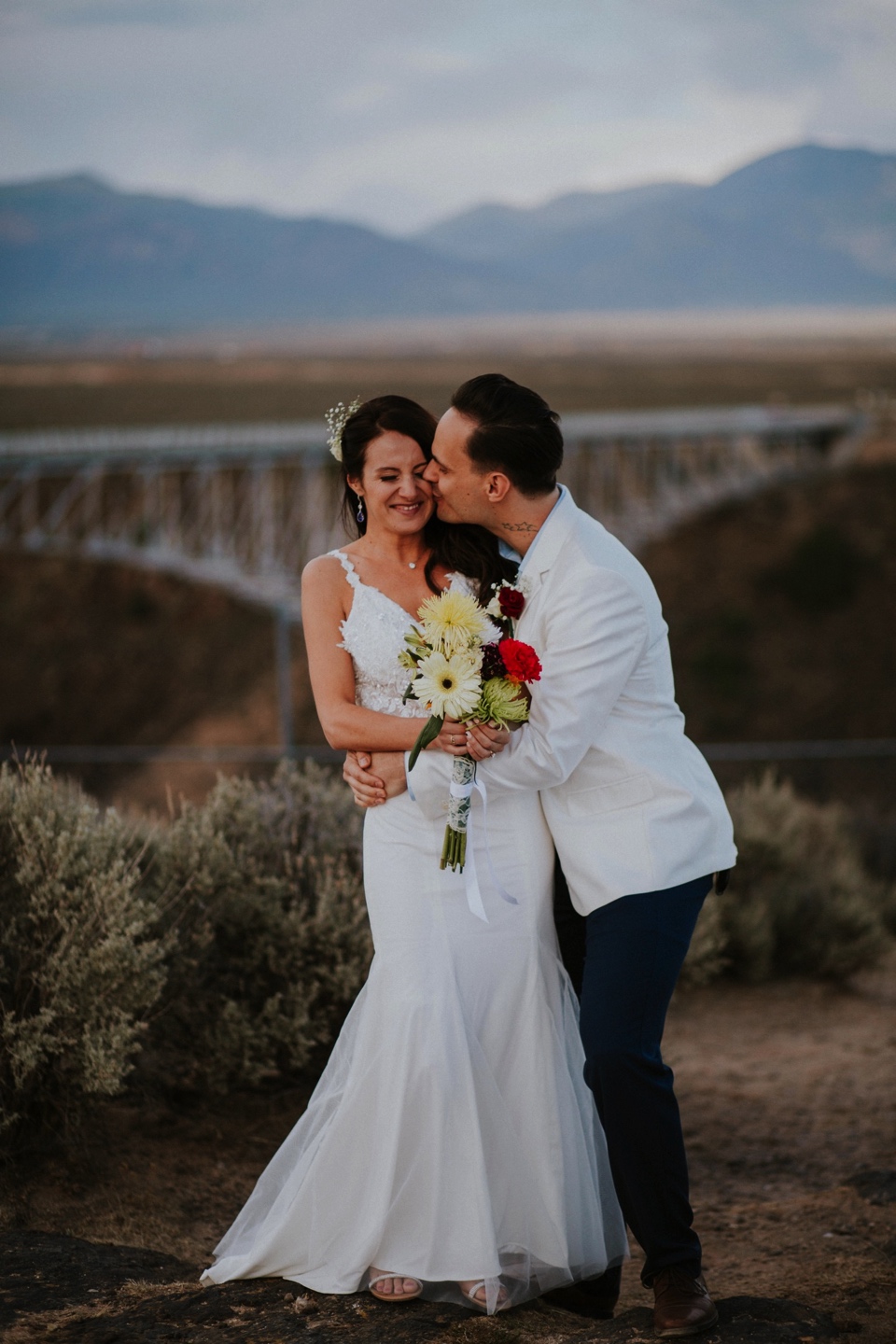  You are going to LOVE these beautiful Rio Grande Gorge Bridge wedding photos from this fabulous Taos elopement! Boris and Jennifer’s sunset elopement was so beautiful, surrounded by their close friends and family that traveled all the way from Vanco