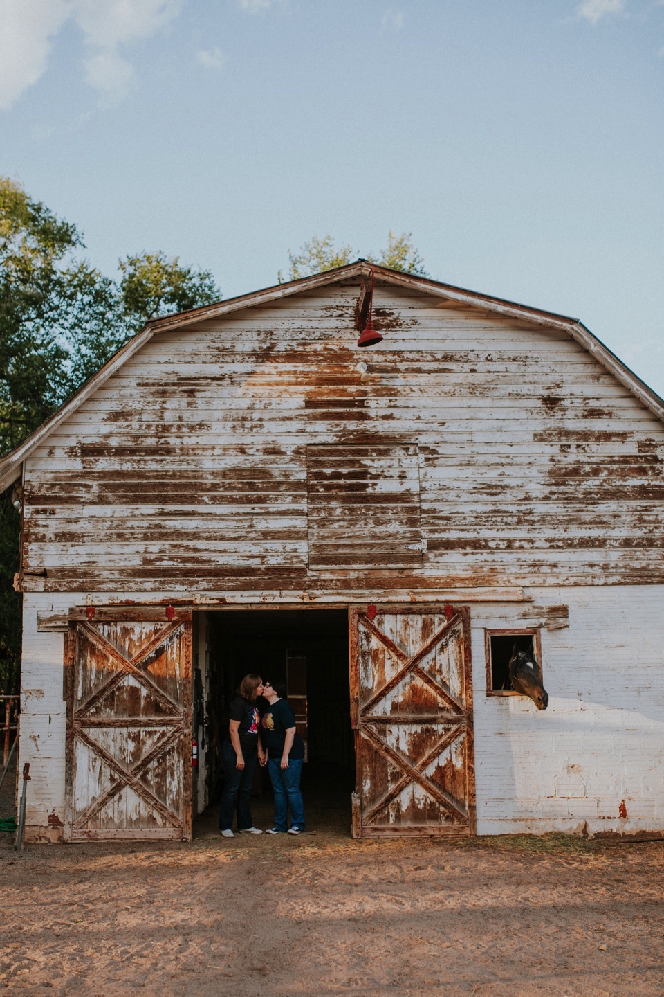  Ryan and Erica’s LGBTQ+ engagement photos at Old Town Farm in Albuquerque, New Mexico are a MUST SEE! Their engagement photos include rocking plaid shirts and converse sneakers, their sweet fur baby, Riley (aka Rileypoo), as well as their love for S