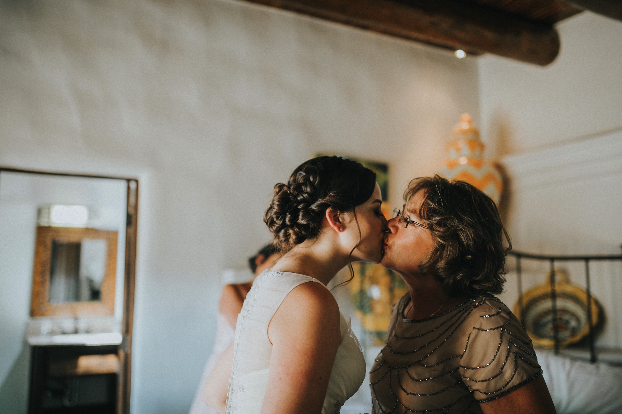  Katie and Frankie’s wedding was what Santa Fe summer wedding dreams are made of! They had a gorgeous catholic wedding ceremony at the Cristo Rey Catholic Church in Santa Fe, New Mexico followed by a fabulous travel-themed wedding reception at La Pos