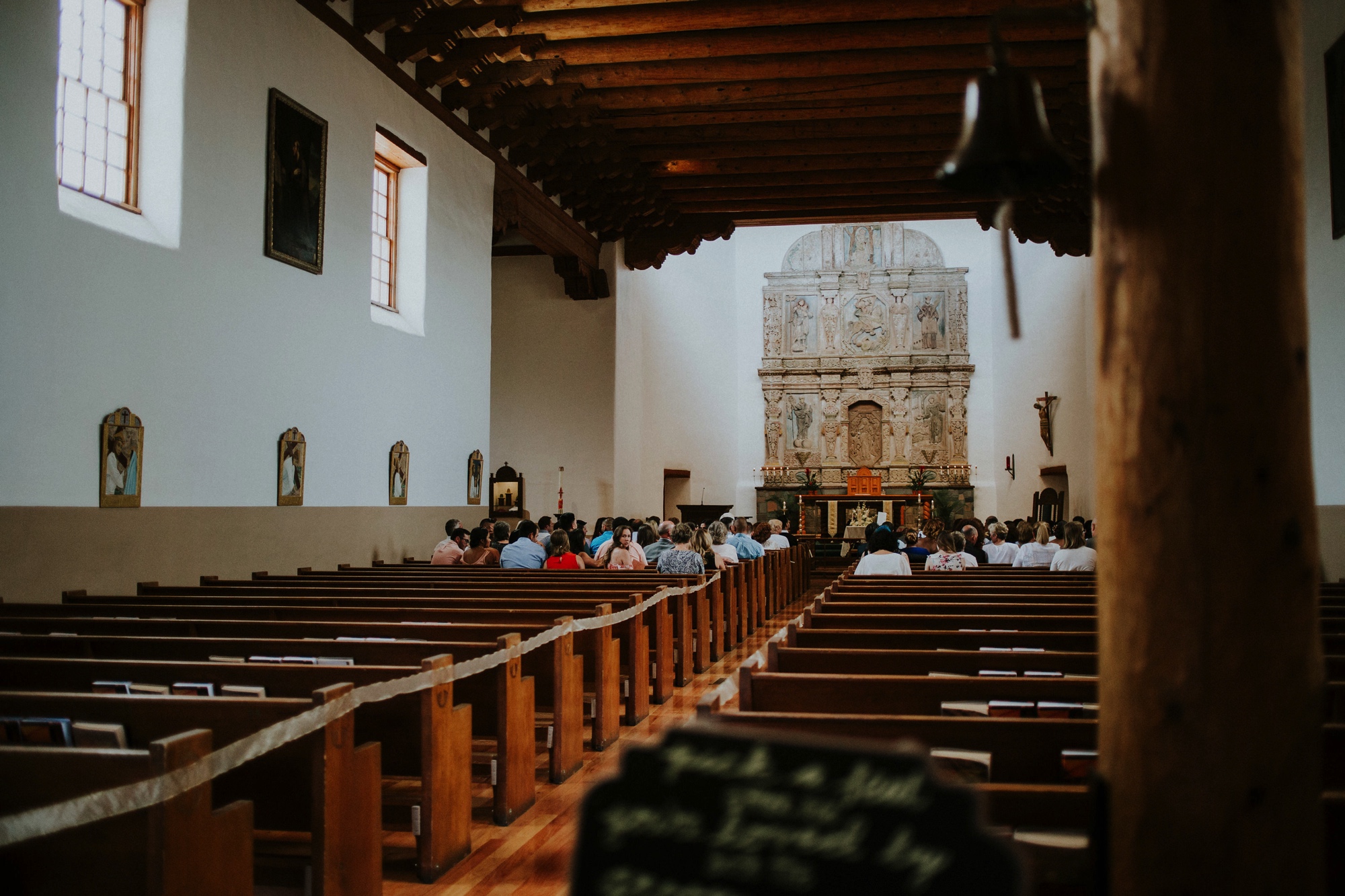  Katie and Frankie’s wedding was what Santa Fe summer wedding dreams are made of! They had a gorgeous catholic wedding ceremony at the Cristo Rey Catholic Church in Santa Fe, New Mexico followed by a fabulous travel-themed wedding reception at La Pos