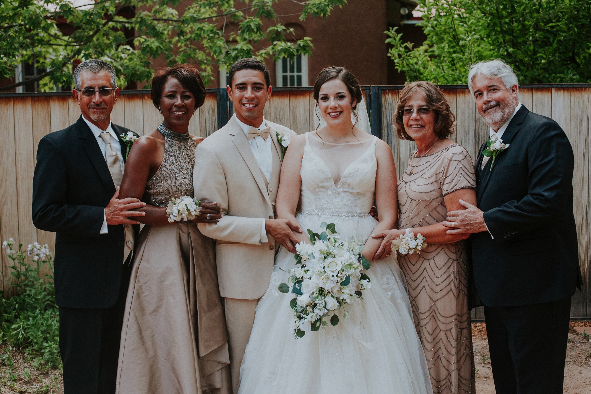  Katie and Frankie’s wedding was what Santa Fe summer wedding dreams are made of! They had a gorgeous catholic wedding ceremony at the Cristo Rey Catholic Church in Santa Fe, New Mexico followed by a fabulous travel-themed wedding reception at La Pos