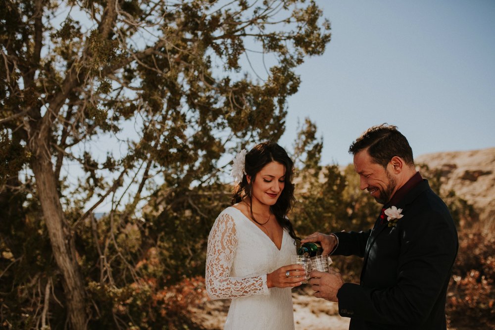  Jade and Alex eloped at the amazing and scenic El Malpais National Monument outside of Grants, New Mexico. It was a beautiful November day and the weather was crisp, fresh, and just a tad chilly, but it didn’t get in the way of their fabulous weddin