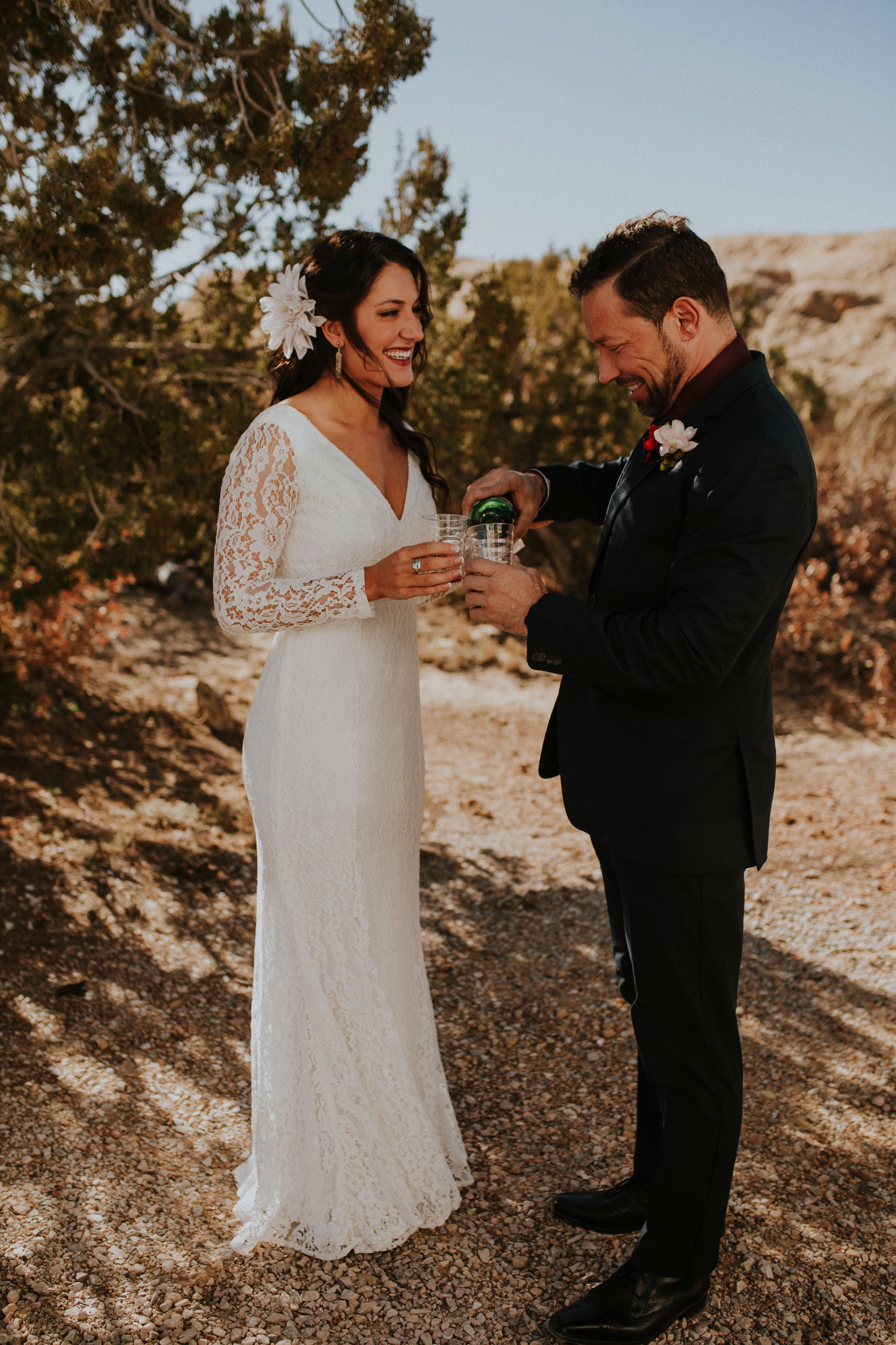  Jade and Alex eloped at the amazing and scenic El Malpais National Monument outside of Grants, New Mexico. It was a beautiful November day and the weather was crisp, fresh, and just a tad chilly, but it didn’t get in the way of their fabulous weddin