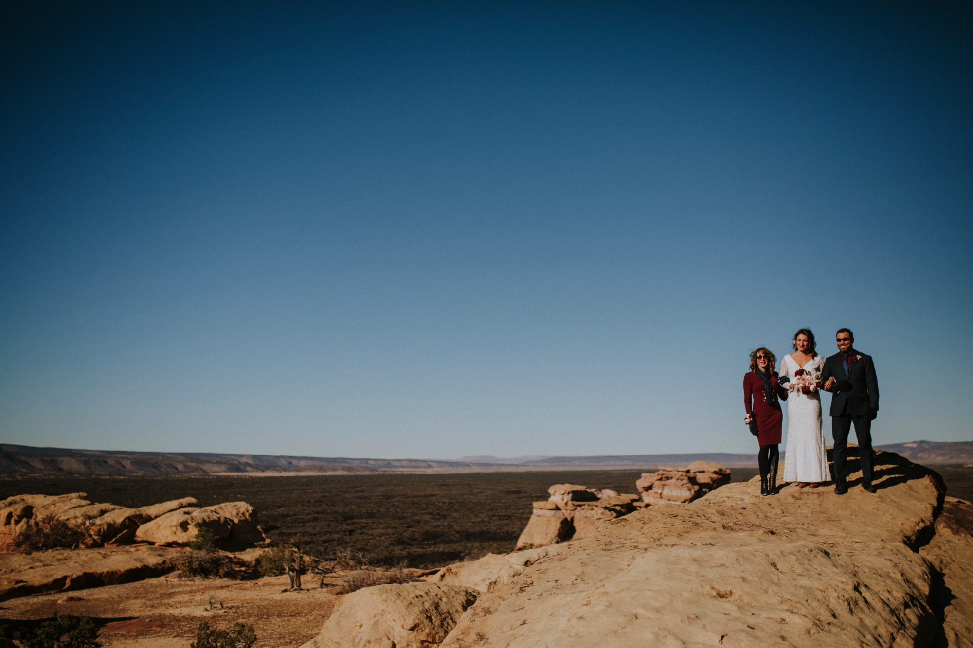  Jade and Alex eloped at the amazing and scenic El Malpais National Monument outside of Grants, New Mexico. It was a beautiful November day and the weather was crisp, fresh, and just a tad chilly, but it didn’t get in the way of their fabulous weddin