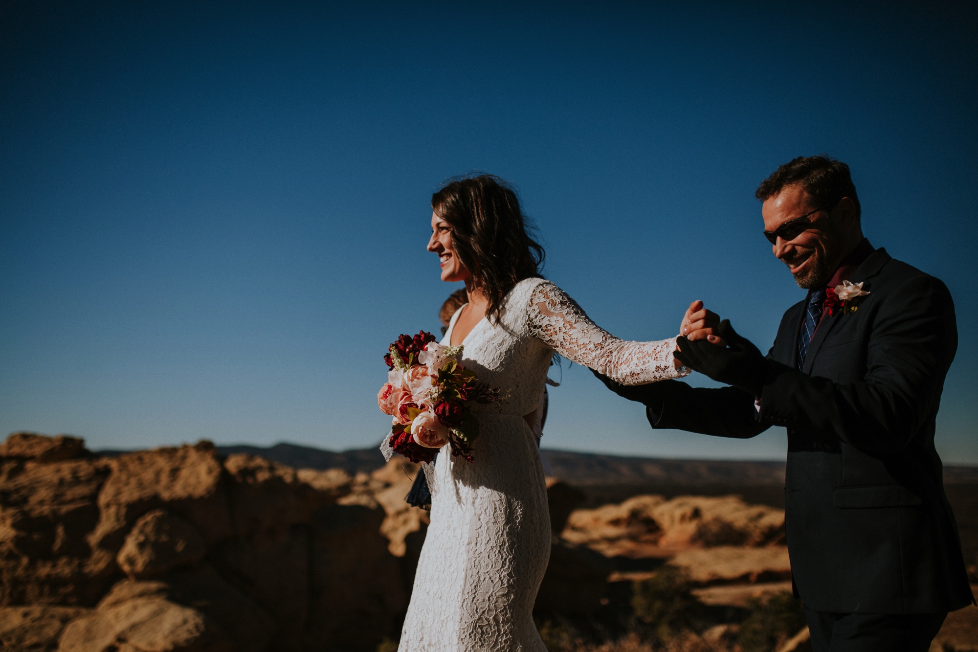  Jade and Alex eloped at the amazing and scenic El Malpais National Monument outside of Grants, New Mexico. It was a beautiful November day and the weather was crisp, fresh, and just a tad chilly, but it didn’t get in the way of their fabulous weddin