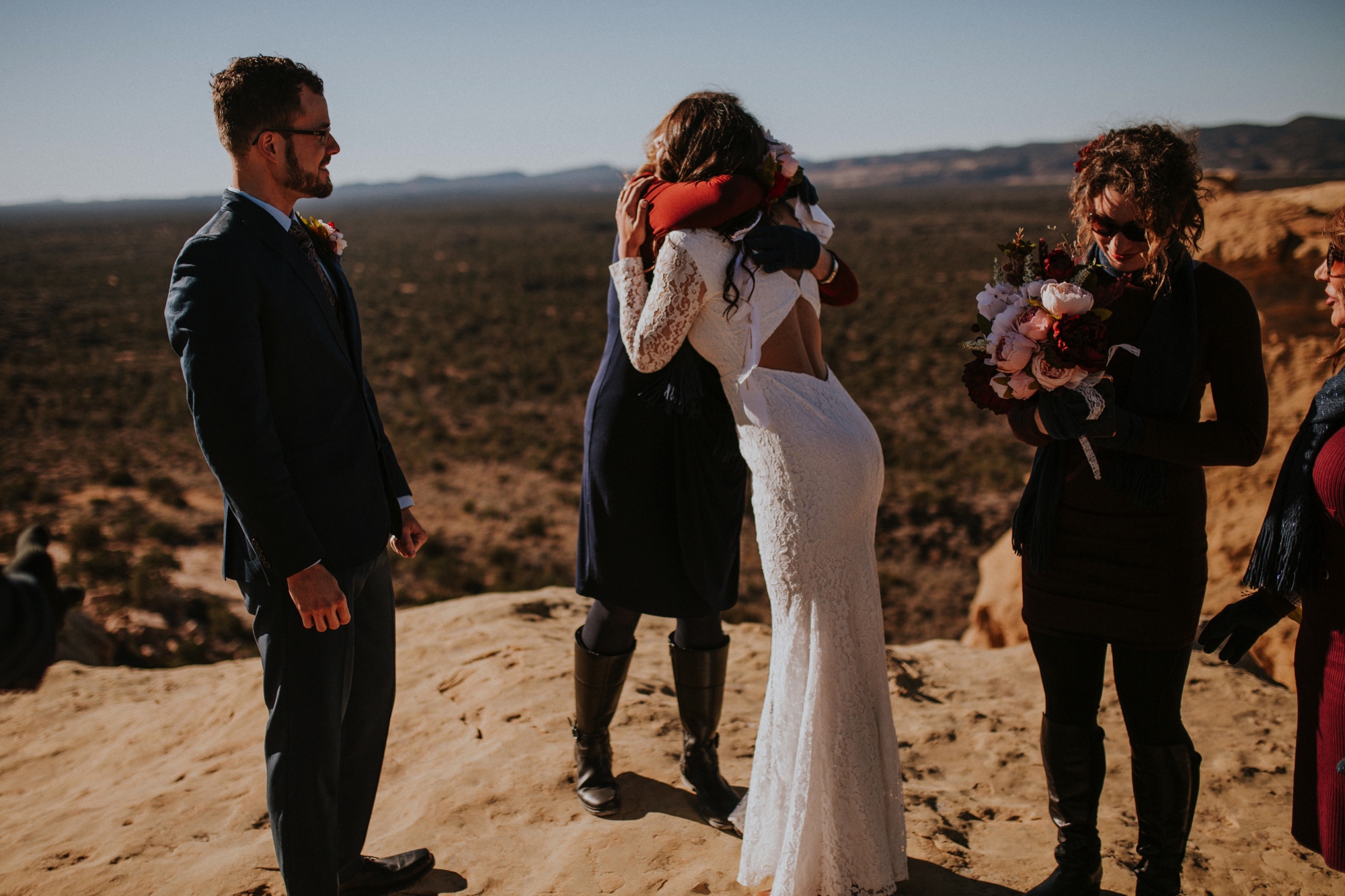  Jade and Alex eloped at the amazing and scenic El Malpais National Monument outside of Grants, New Mexico. It was a beautiful November day and the weather was crisp, fresh, and just a tad chilly, but it didn’t get in the way of their fabulous weddin