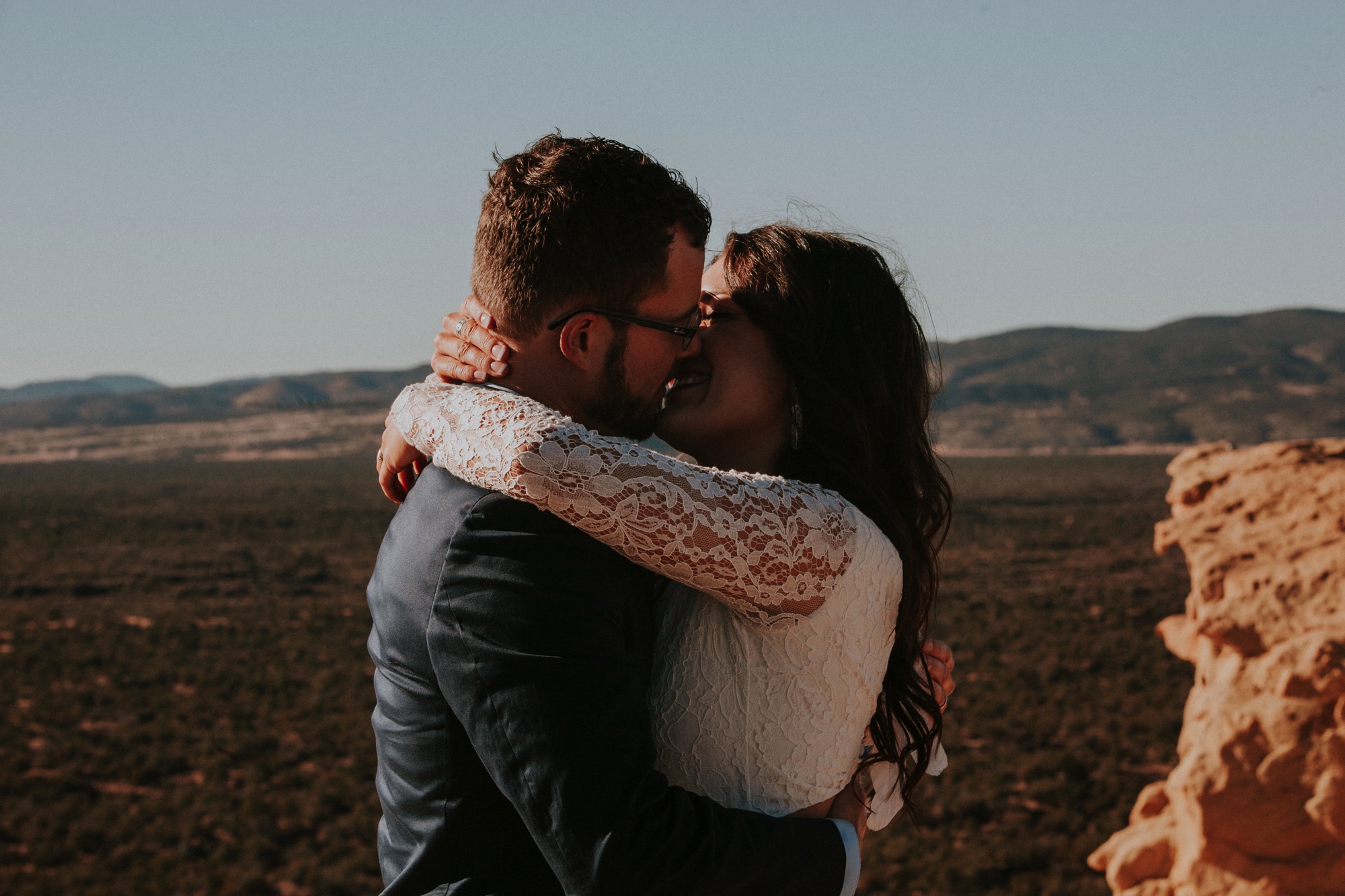  Jade and Alex eloped at the amazing and scenic El Malpais National Monument outside of Grants, New Mexico. It was a beautiful November day and the weather was crisp, fresh, and just a tad chilly, but it didn’t get in the way of their fabulous weddin