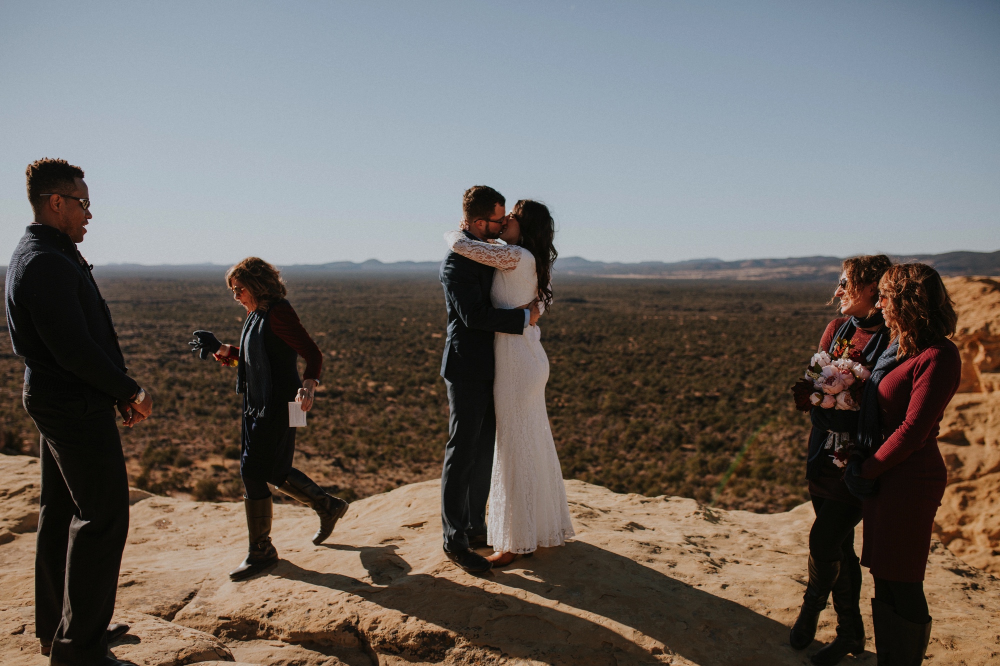  Jade and Alex eloped at the amazing and scenic El Malpais National Monument outside of Grants, New Mexico. It was a beautiful November day and the weather was crisp, fresh, and just a tad chilly, but it didn’t get in the way of their fabulous weddin