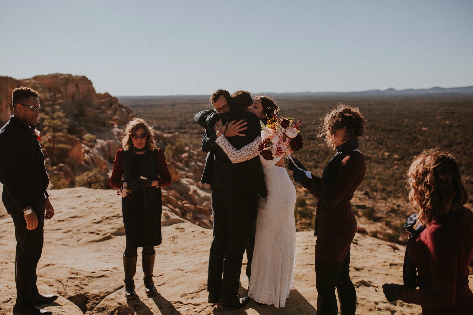  Jade and Alex eloped at the amazing and scenic El Malpais National Monument outside of Grants, New Mexico. It was a beautiful November day and the weather was crisp, fresh, and just a tad chilly, but it didn’t get in the way of their fabulous weddin