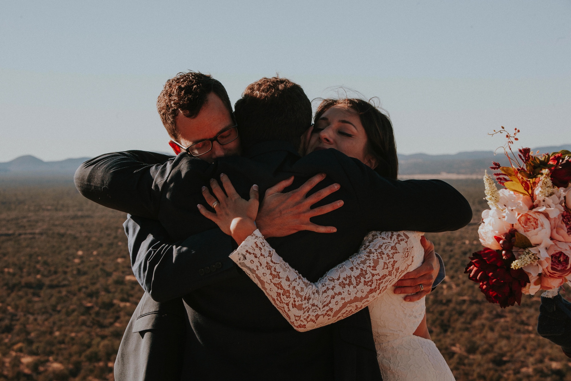  Jade and Alex eloped at the amazing and scenic El Malpais National Monument outside of Grants, New Mexico. It was a beautiful November day and the weather was crisp, fresh, and just a tad chilly, but it didn’t get in the way of their fabulous weddin