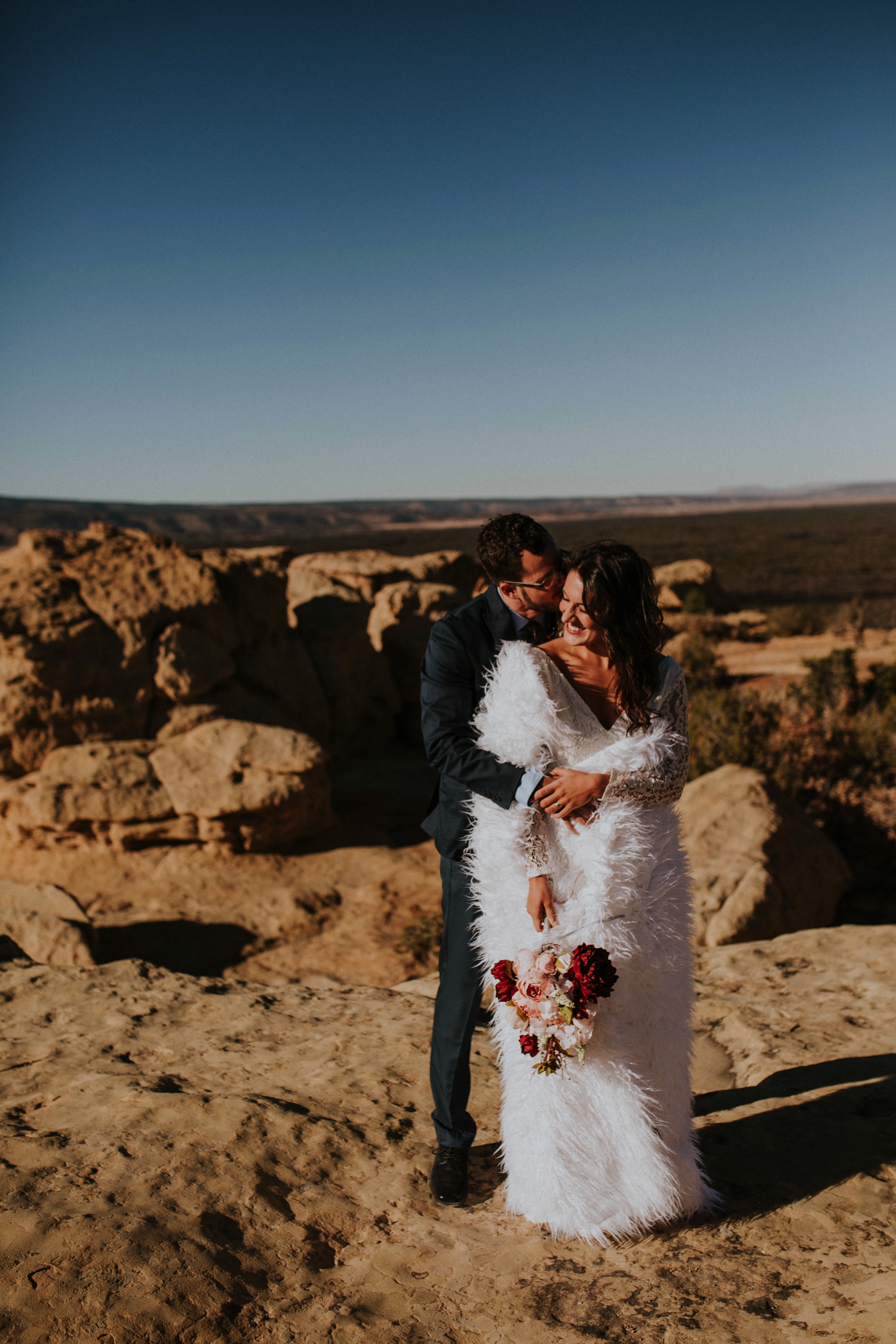  Jade and Alex eloped at the amazing and scenic El Malpais National Monument outside of Grants, New Mexico. It was a beautiful November day and the weather was crisp, fresh, and just a tad chilly, but it didn’t get in the way of their fabulous weddin