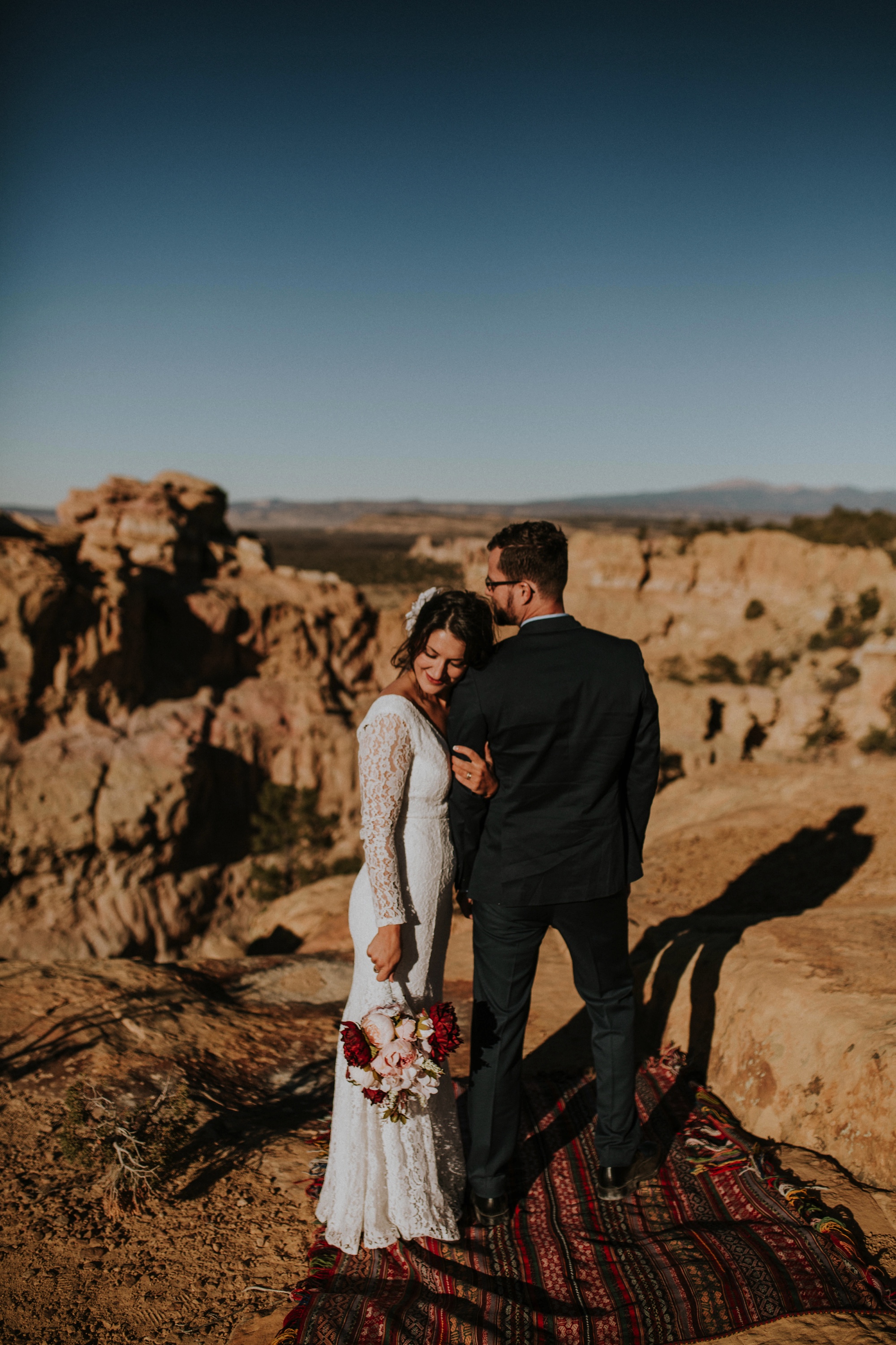  Jade and Alex eloped at the amazing and scenic El Malpais National Monument outside of Grants, New Mexico. It was a beautiful November day and the weather was crisp, fresh, and just a tad chilly, but it didn’t get in the way of their fabulous weddin