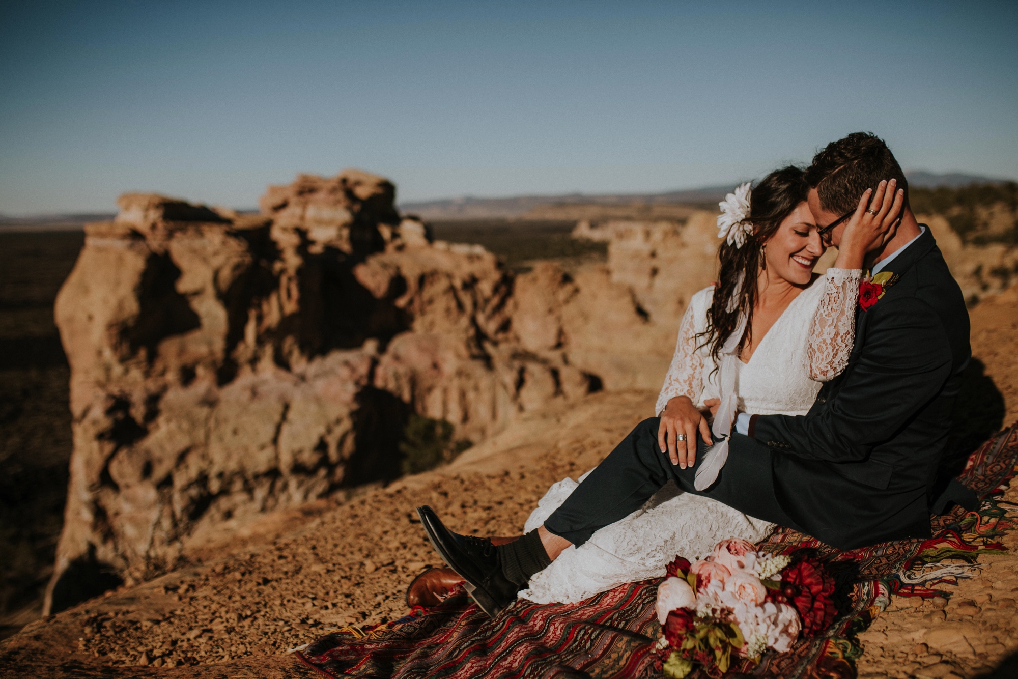  Jade and Alex eloped at the amazing and scenic El Malpais National Monument outside of Grants, New Mexico. It was a beautiful November day and the weather was crisp, fresh, and just a tad chilly, but it didn’t get in the way of their fabulous weddin