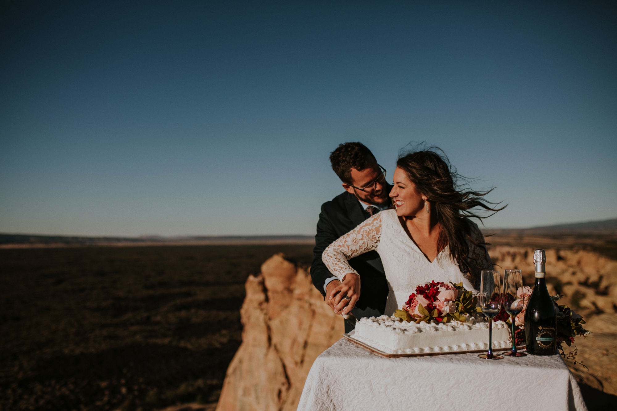  Jade and Alex eloped at the amazing and scenic El Malpais National Monument outside of Grants, New Mexico. It was a beautiful November day and the weather was crisp, fresh, and just a tad chilly, but it didn’t get in the way of their fabulous weddin