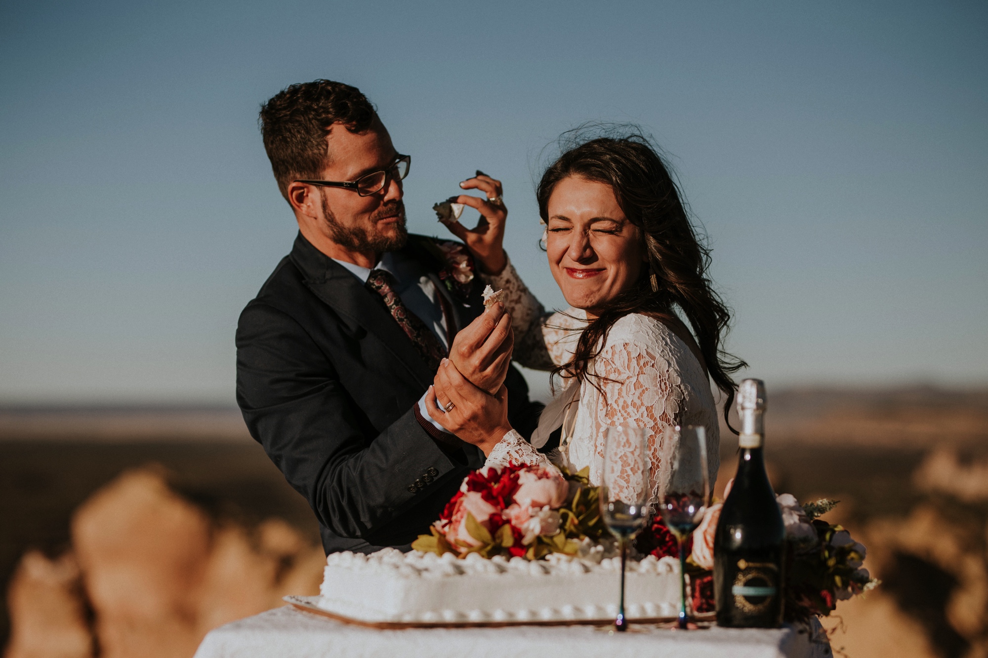  Jade and Alex eloped at the amazing and scenic El Malpais National Monument outside of Grants, New Mexico. It was a beautiful November day and the weather was crisp, fresh, and just a tad chilly, but it didn’t get in the way of their fabulous weddin