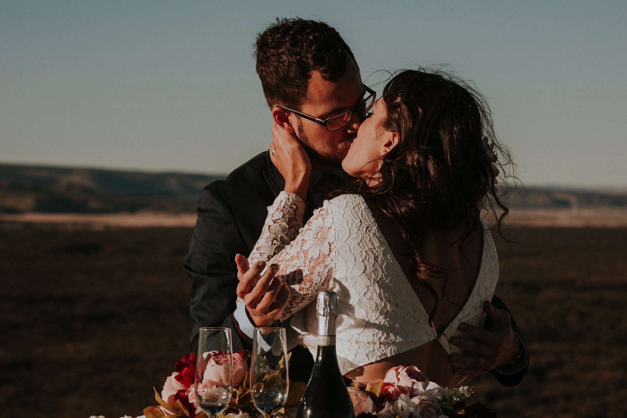  Jade and Alex eloped at the amazing and scenic El Malpais National Monument outside of Grants, New Mexico. It was a beautiful November day and the weather was crisp, fresh, and just a tad chilly, but it didn’t get in the way of their fabulous weddin