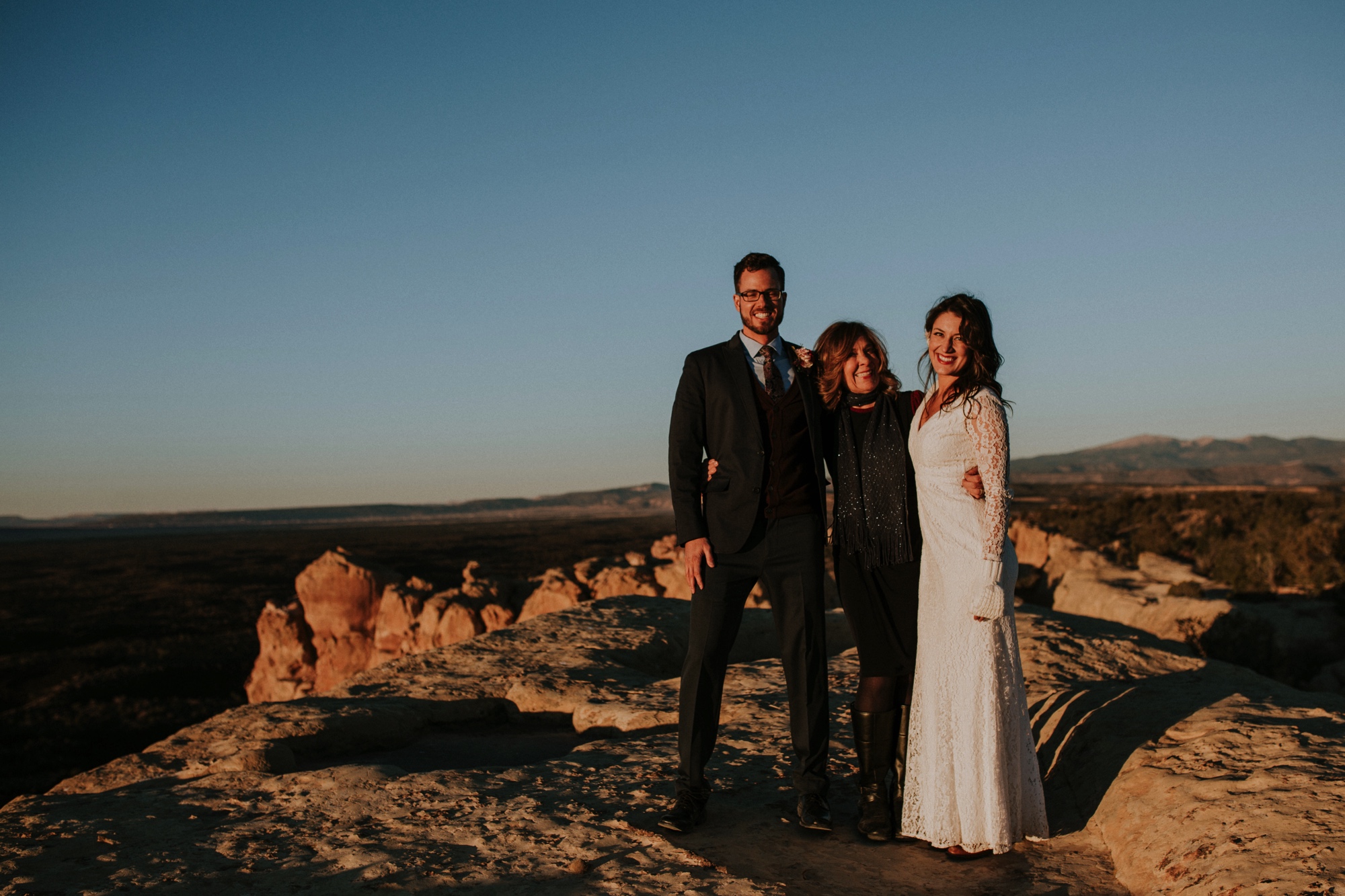  Jade and Alex eloped at the amazing and scenic El Malpais National Monument outside of Grants, New Mexico. It was a beautiful November day and the weather was crisp, fresh, and just a tad chilly, but it didn’t get in the way of their fabulous weddin