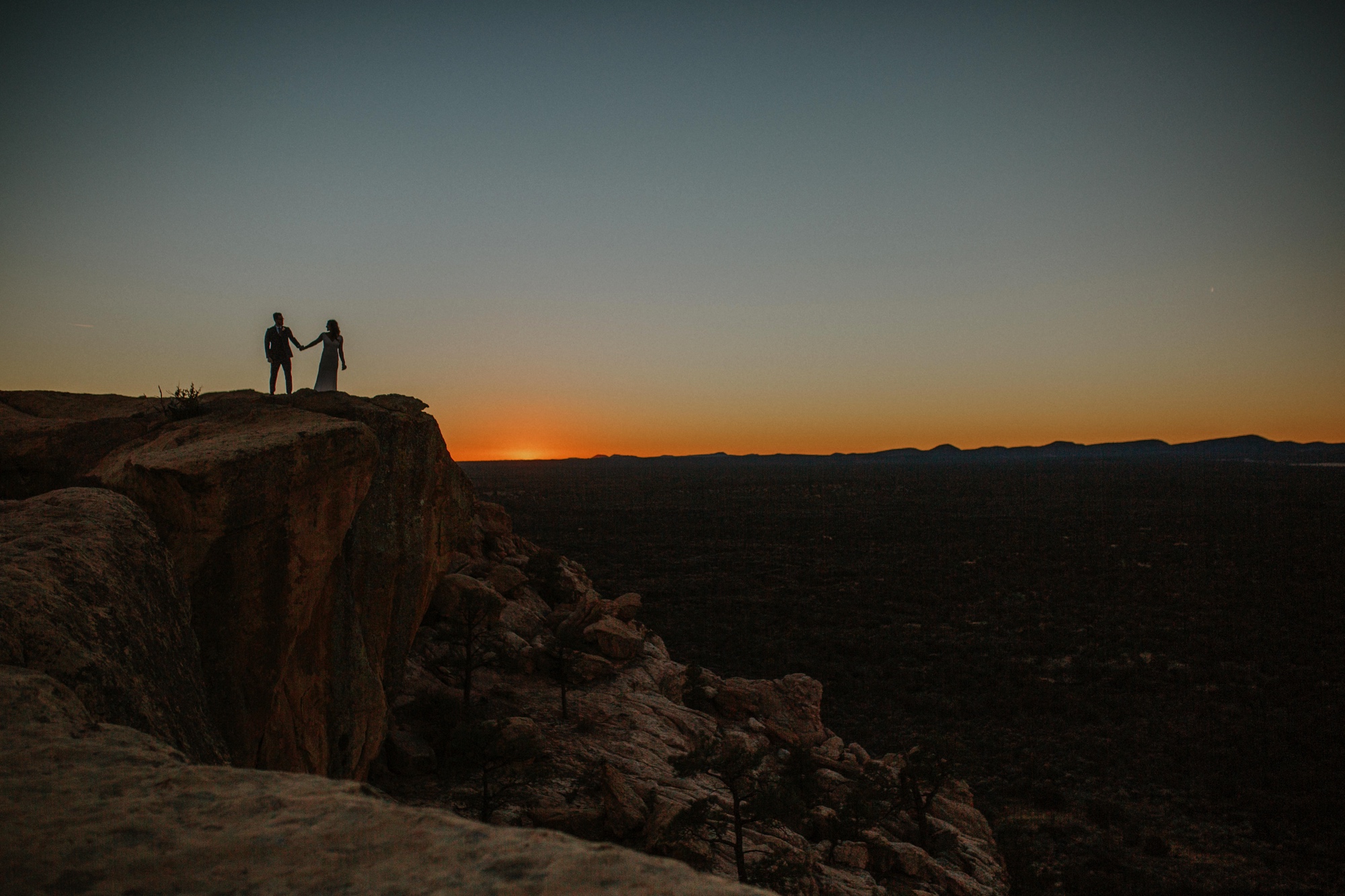  Jade and Alex eloped at the amazing and scenic El Malpais National Monument outside of Grants, New Mexico. It was a beautiful November day and the weather was crisp, fresh, and just a tad chilly, but it didn’t get in the way of their fabulous weddin