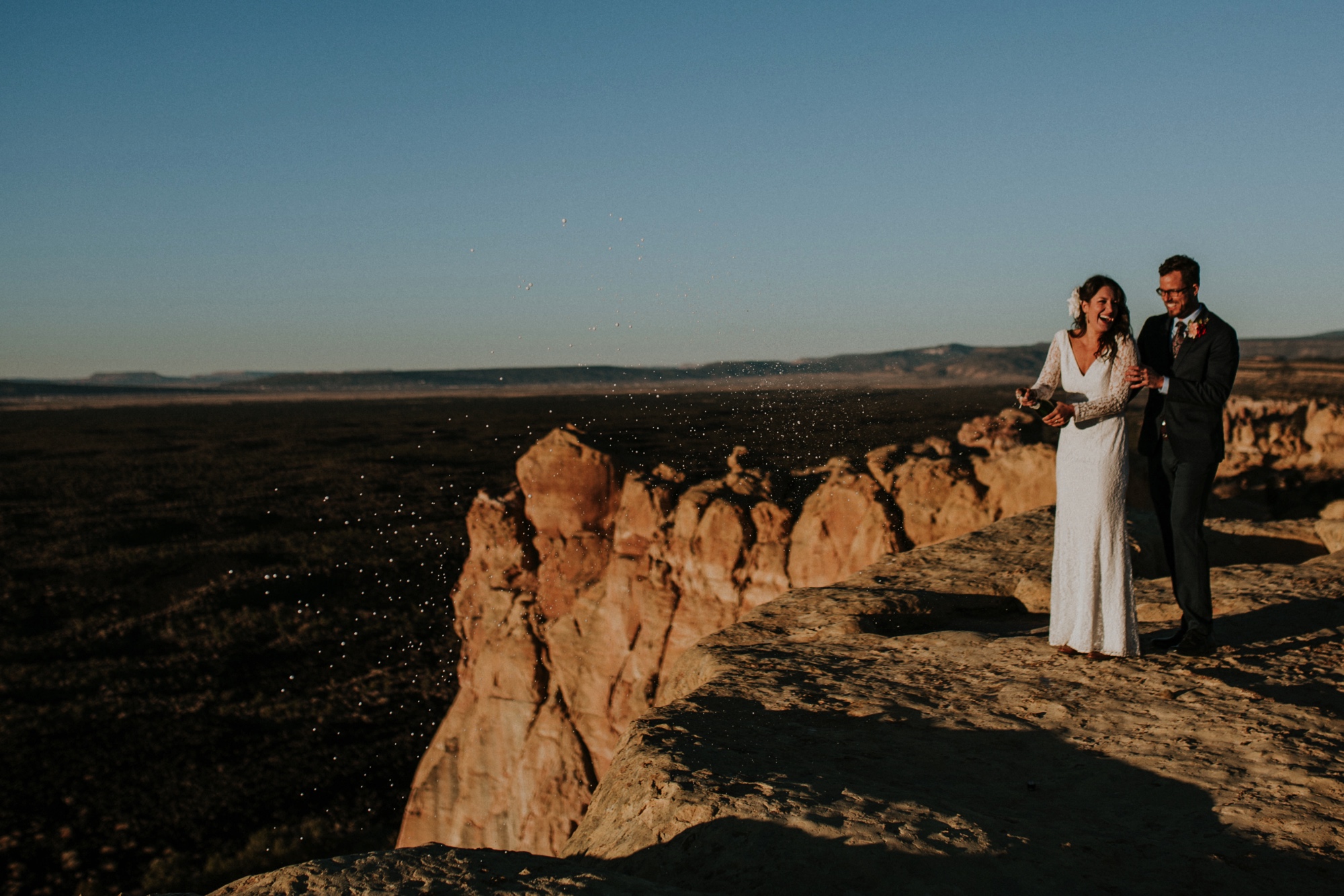  Jade and Alex eloped at the amazing and scenic El Malpais National Monument outside of Grants, New Mexico. It was a beautiful November day and the weather was crisp, fresh, and just a tad chilly, but it didn’t get in the way of their fabulous weddin