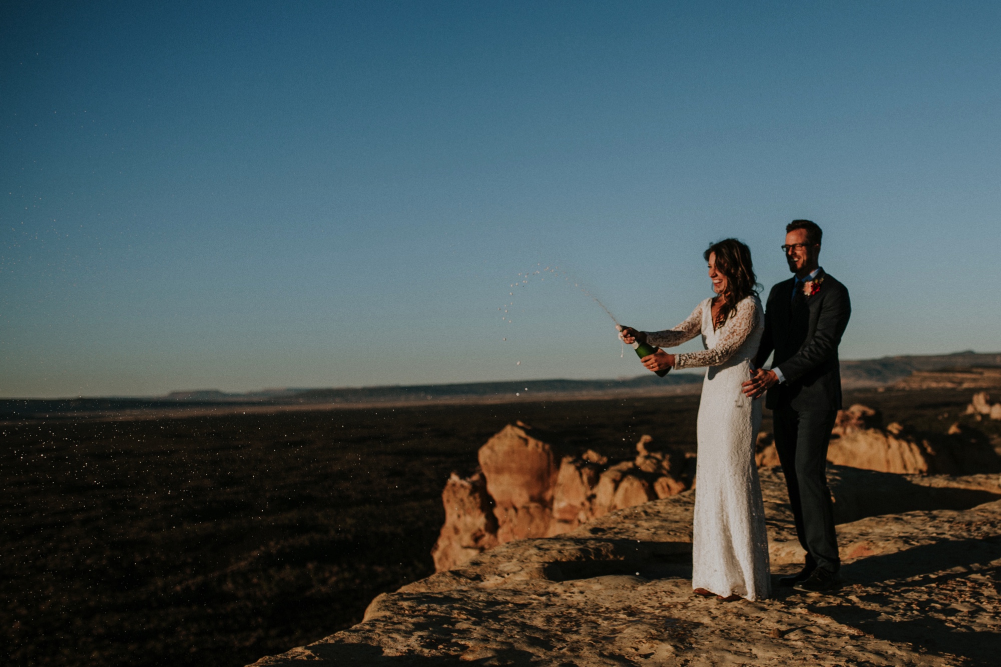  Jade and Alex eloped at the amazing and scenic El Malpais National Monument outside of Grants, New Mexico. It was a beautiful November day and the weather was crisp, fresh, and just a tad chilly, but it didn’t get in the way of their fabulous weddin