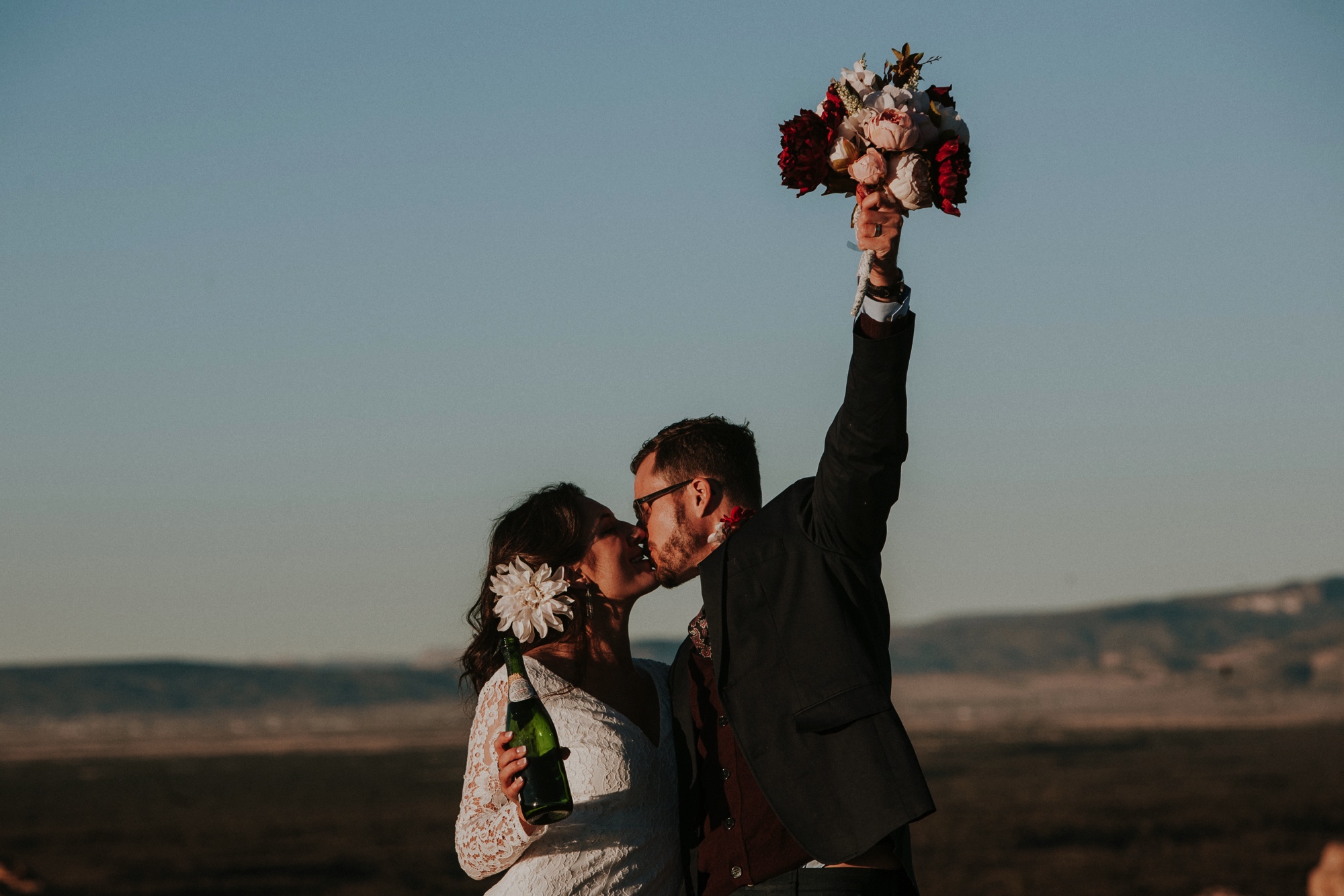  Jade and Alex eloped at the amazing and scenic El Malpais National Monument outside of Grants, New Mexico. It was a beautiful November day and the weather was crisp, fresh, and just a tad chilly, but it didn’t get in the way of their fabulous weddin