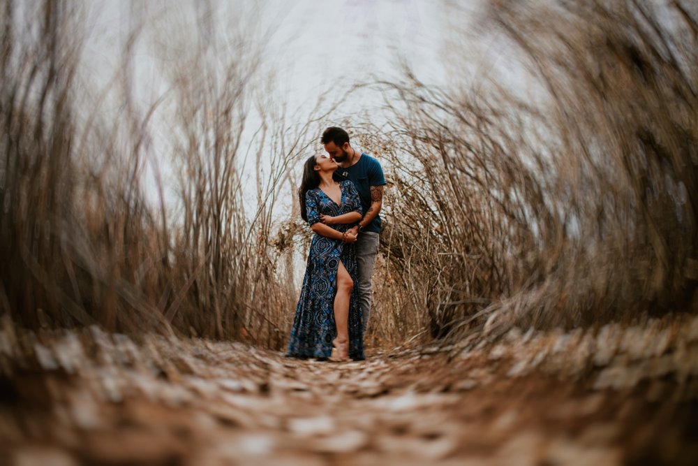  I loved working with Xamie and Nate on this incredible couples portrait session at the Alameda Bosque Open Space in Albuquerque, New Mexico. Our session started off with grey overcast skies that made for some moody portraits! Xamie’s blue dress and 