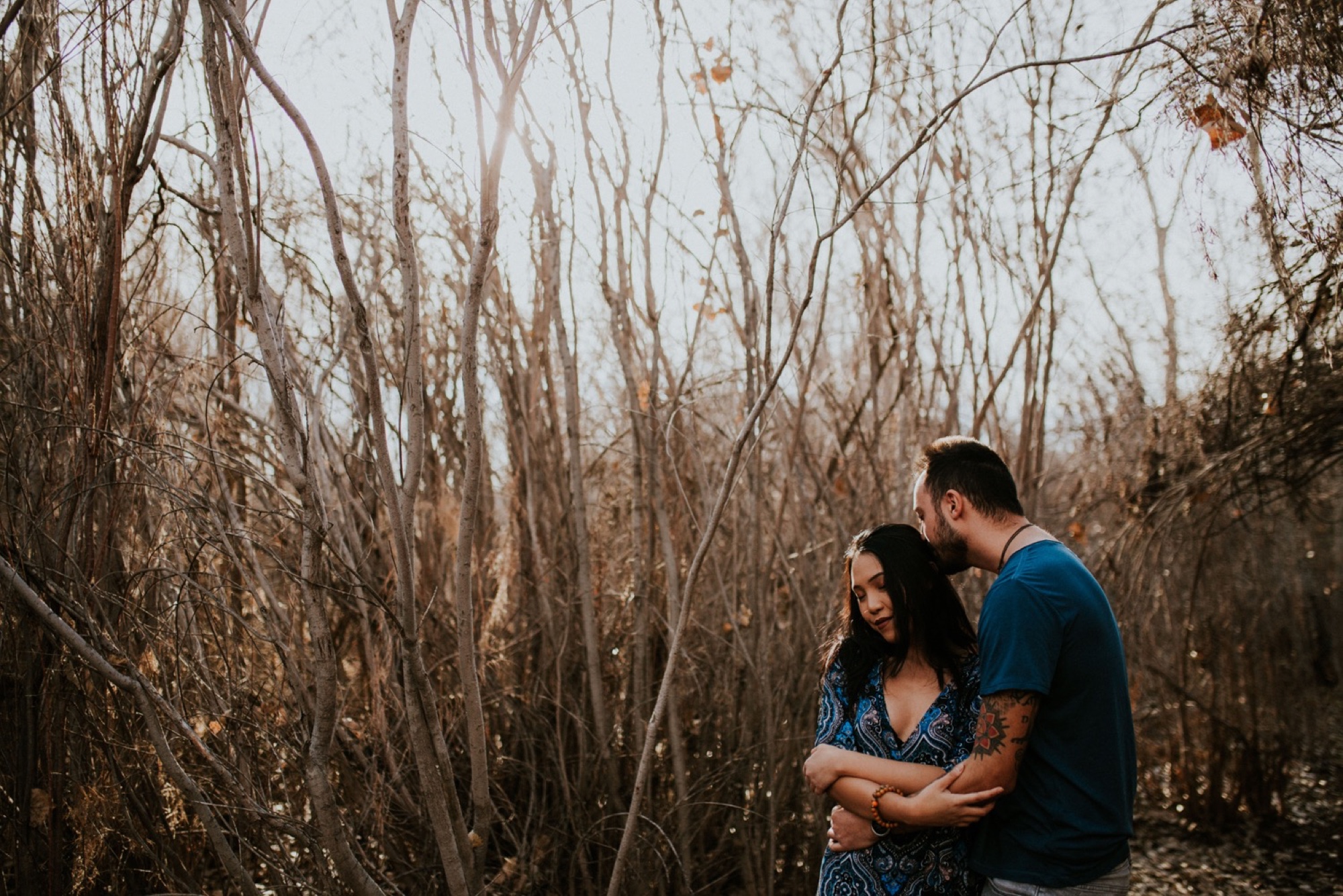  I loved working with Xamie and Nate on this incredible couples portrait session at the Alameda Bosque Open Space in Albuquerque, New Mexico. Our session started off with grey overcast skies that made for some moody portraits! Xamie’s blue dress and 