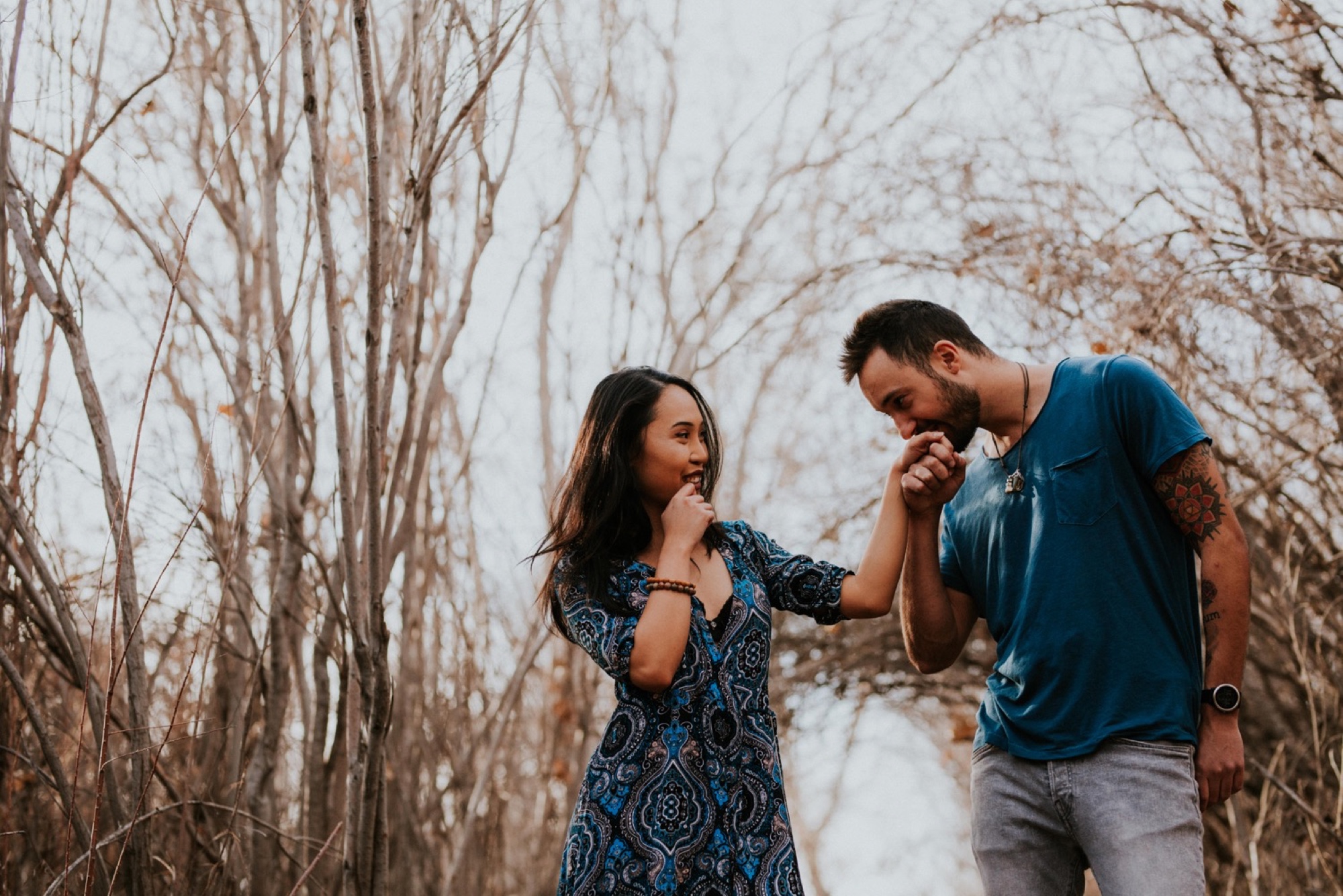  I loved working with Xamie and Nate on this incredible couples portrait session at the Alameda Bosque Open Space in Albuquerque, New Mexico. Our session started off with grey overcast skies that made for some moody portraits! Xamie’s blue dress and 