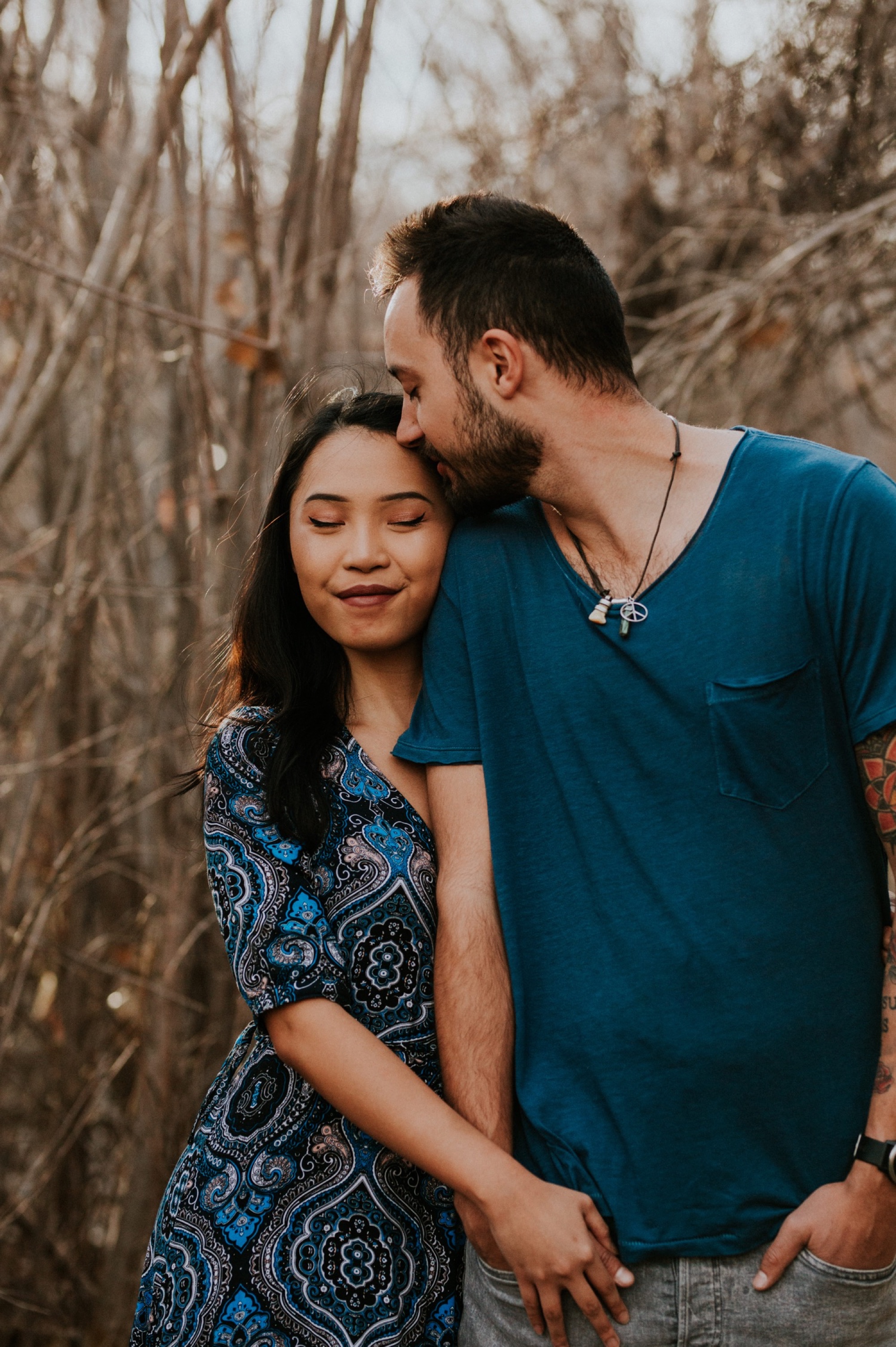  I loved working with Xamie and Nate on this incredible couples portrait session at the Alameda Bosque Open Space in Albuquerque, New Mexico. Our session started off with grey overcast skies that made for some moody portraits! Xamie’s blue dress and 