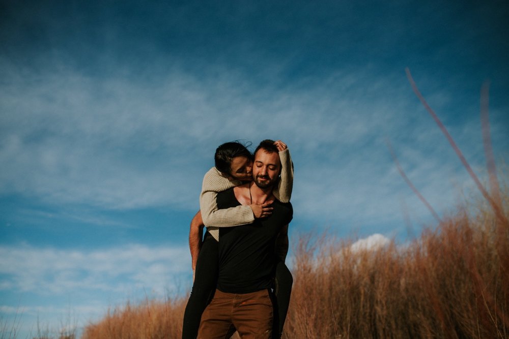  I loved working with Xamie and Nate on this incredible couples portrait session at the Alameda Bosque Open Space in Albuquerque, New Mexico. Our session started off with grey overcast skies that made for some moody portraits! Xamie and Nate’s outfit