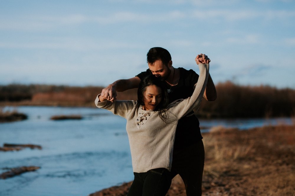  I loved working with Xamie and Nate on this incredible couples portrait session at the Alameda Bosque Open Space in Albuquerque, New Mexico. Our session started off with grey overcast skies that made for some moody portraits! Xamie and Nate’s outfit