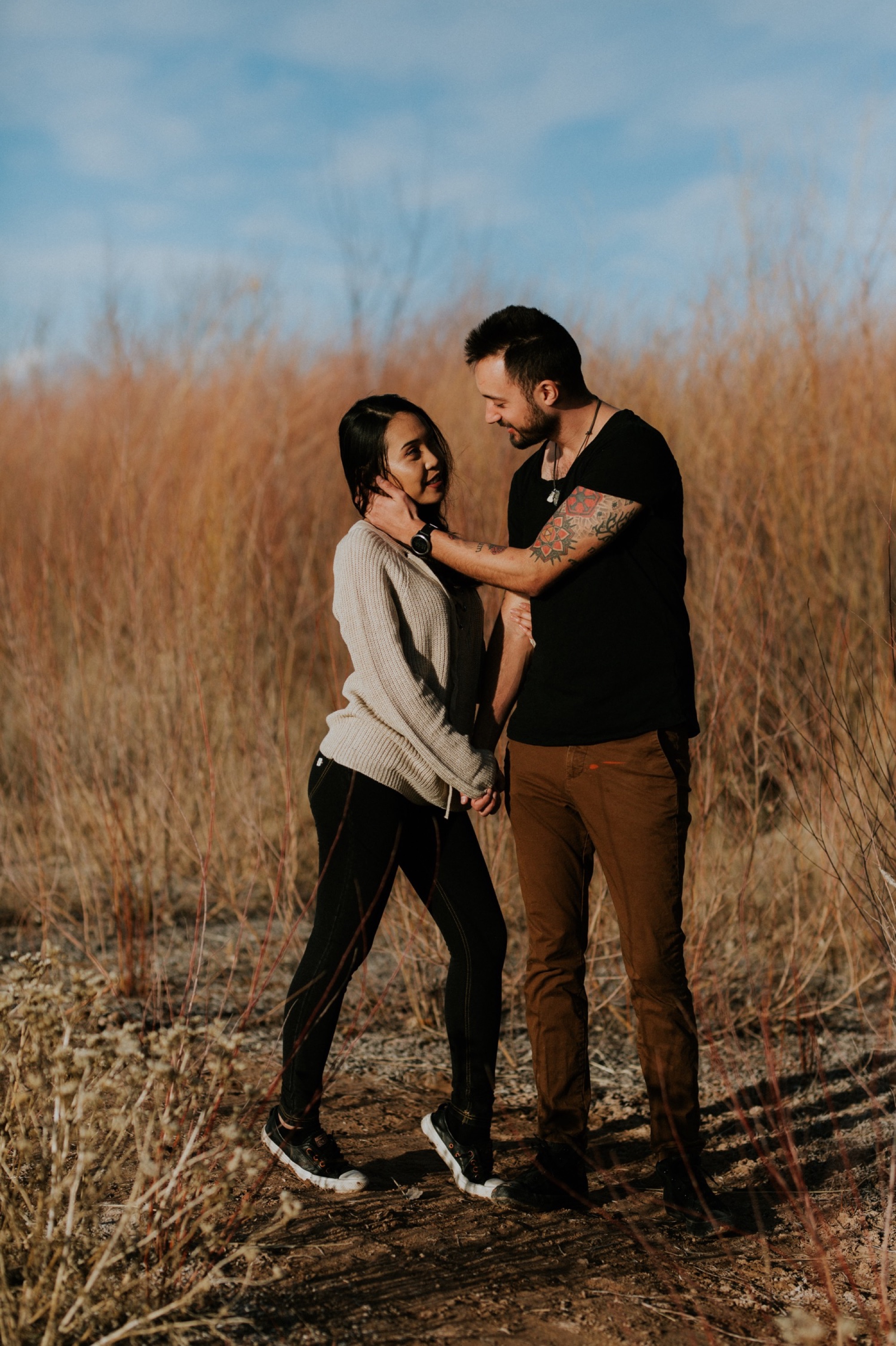  I loved working with Xamie and Nate on this incredible couples portrait session at the Alameda Bosque Open Space in Albuquerque, New Mexico. Our session started off with grey overcast skies that made for some moody portraits! Xamie and Nate’s outfit